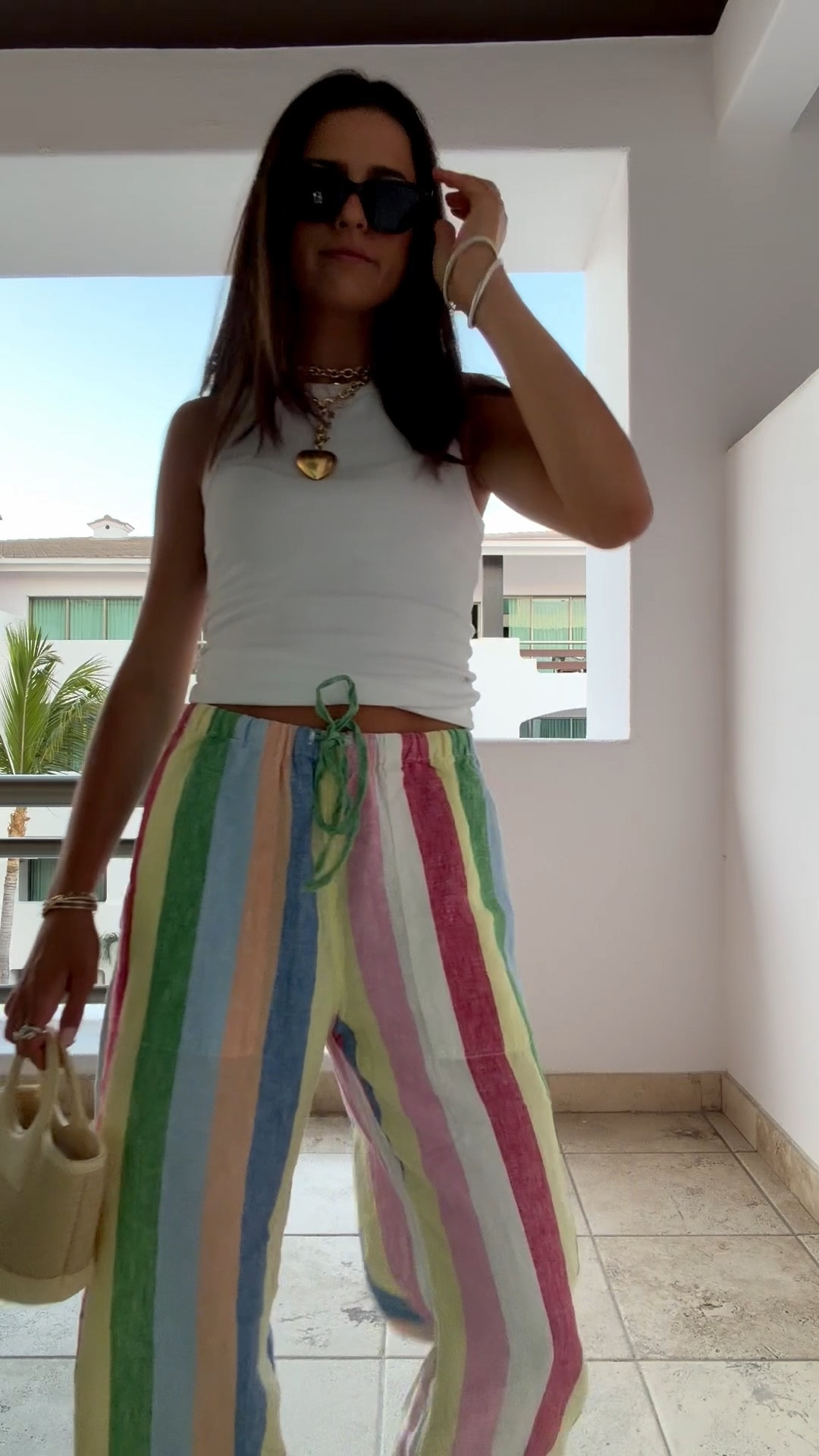 cabo night 1 ootd !! @Roxanne Assoulin puffy heart necklace 
@Target white rubbed tank 
@faherty linen rainbow pants form @Shopbop 
@Anthropologie bag @lespecs sunglasses from @Shopbop 





resort wear, neon, bright colors, two piece set, 2 piece,  Stripe pattern, Scalloped trim, poplin, mexico, hawaii, cabo, Europe, european summer  
colorful outfit

#ltkseasonal #ltktravel #LTKVlog


#LTKTravel #LTKBeauty #LTKdayinmylife #LTKU
