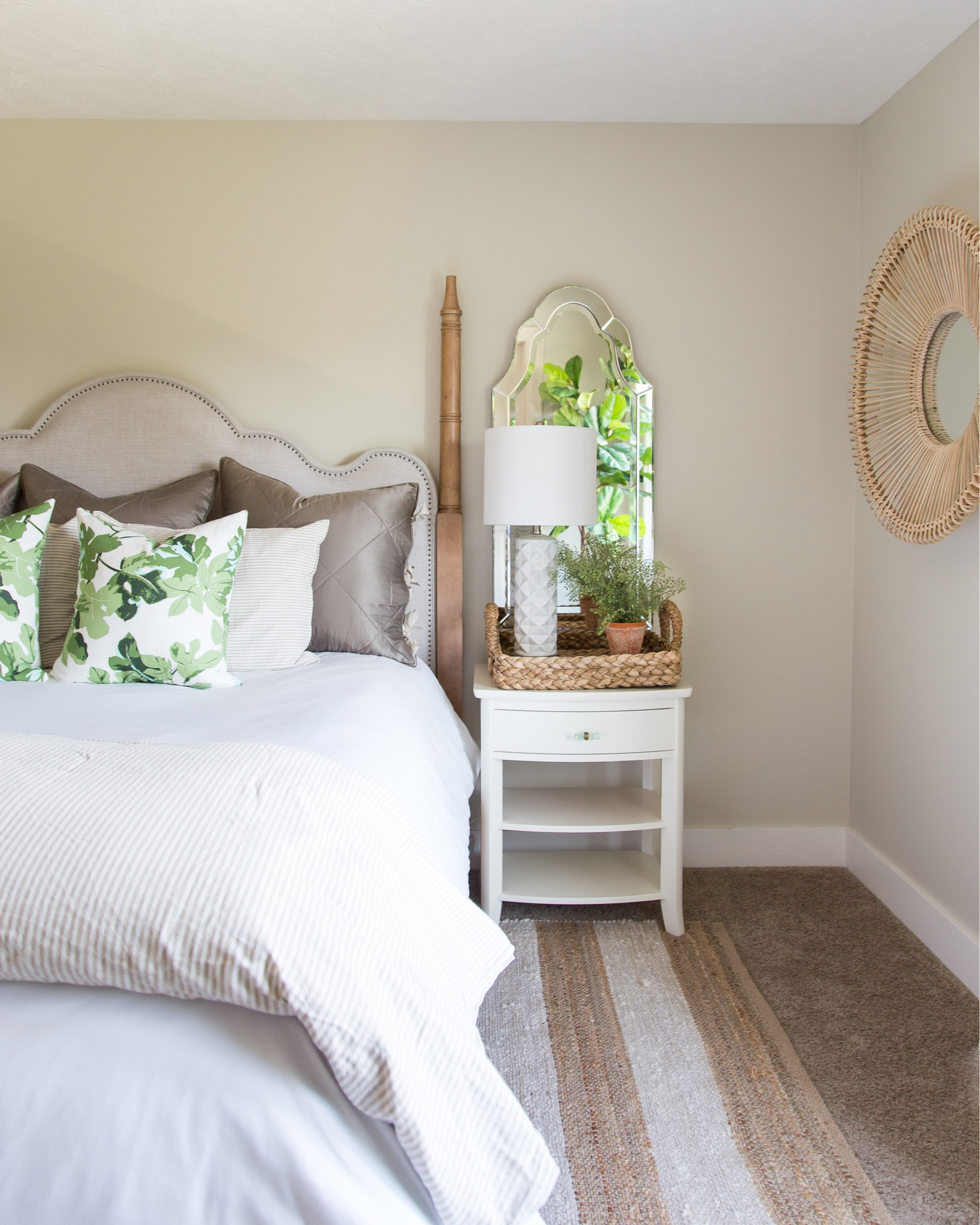 Our bedroom decorated for fall! These neutral items include a striped linen duvet, a linen sham, fig leaf print pillow, an upholstered four post bed, a round rattan mirror, a white nightstand and a neutral striped rug. Other items include a woven tray, a white ceramic table lamp, a beveled wall mirror and a faux fern. Items not shown include white linen blackout curtains, wood beaded chandelier and a faux fiddle leaf fig  

simple decor, neutral décor, home decor, master bedroom decor, guest bedroom design, targetfanatic, target style, amazon finds, walmart home, faux fiddle lead tree, amazon home, bedroom bedding, long size bed, bedroom rugs, guest bedroom decor, studio mcgee, target finds, target home, target wall décor, master bedroom inspiration, guest bedroom inspo, bedroom rugs on carpet, bedroom area rugs, guest bedroom décor, pottery barn bedding, pottery barn furniture, pottery barn master bedroom, bedroom benches, coastal design, master bedroom, coastal bedroom, simple decorating, bedroom decorating  #ltkfamily #ltksalealert  

#LTKSeasonal #LTKunder50 #LTKunder100 #LTKhome #LTKstyletip #LTKfamily #LTKSeasonal #LTKhome