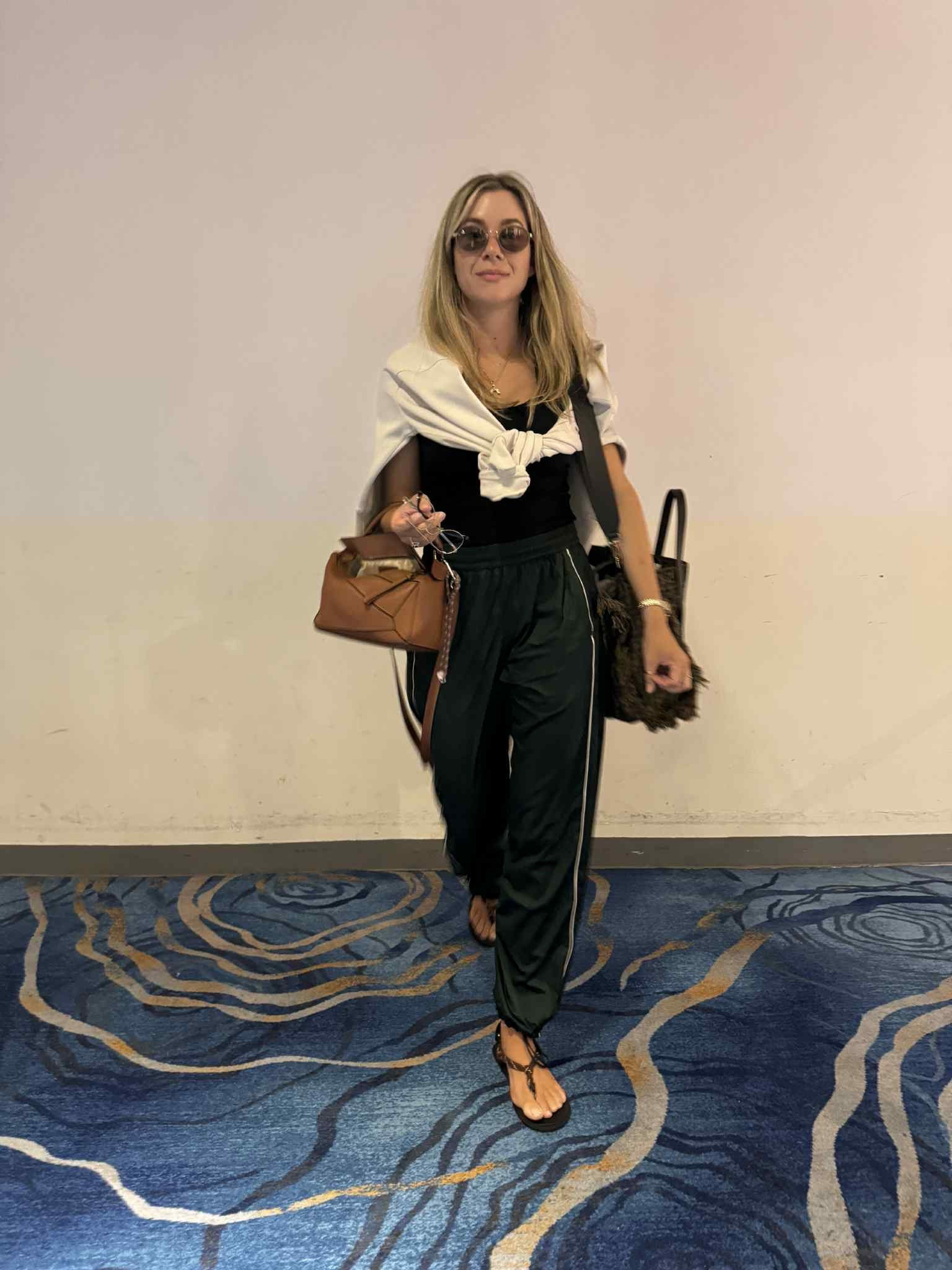 Airport outfit for the second leg of our flight to Europe!

Stretch Satin Nylon Mid-Rise Pant Rainforest Green/Light Ivory size US M (AU 12) lululemon
Scuba Oversized Funnel-Neck Half Zip Heathered Bone/Gold size US XS/S lululemon
Theo Tank Black size AU 10 DISSH
Riviere Cord Leather Sandals size IT41 Miu Miu

#LTKAroundTheWorld 

#LTKaustralia #LTKstyletip