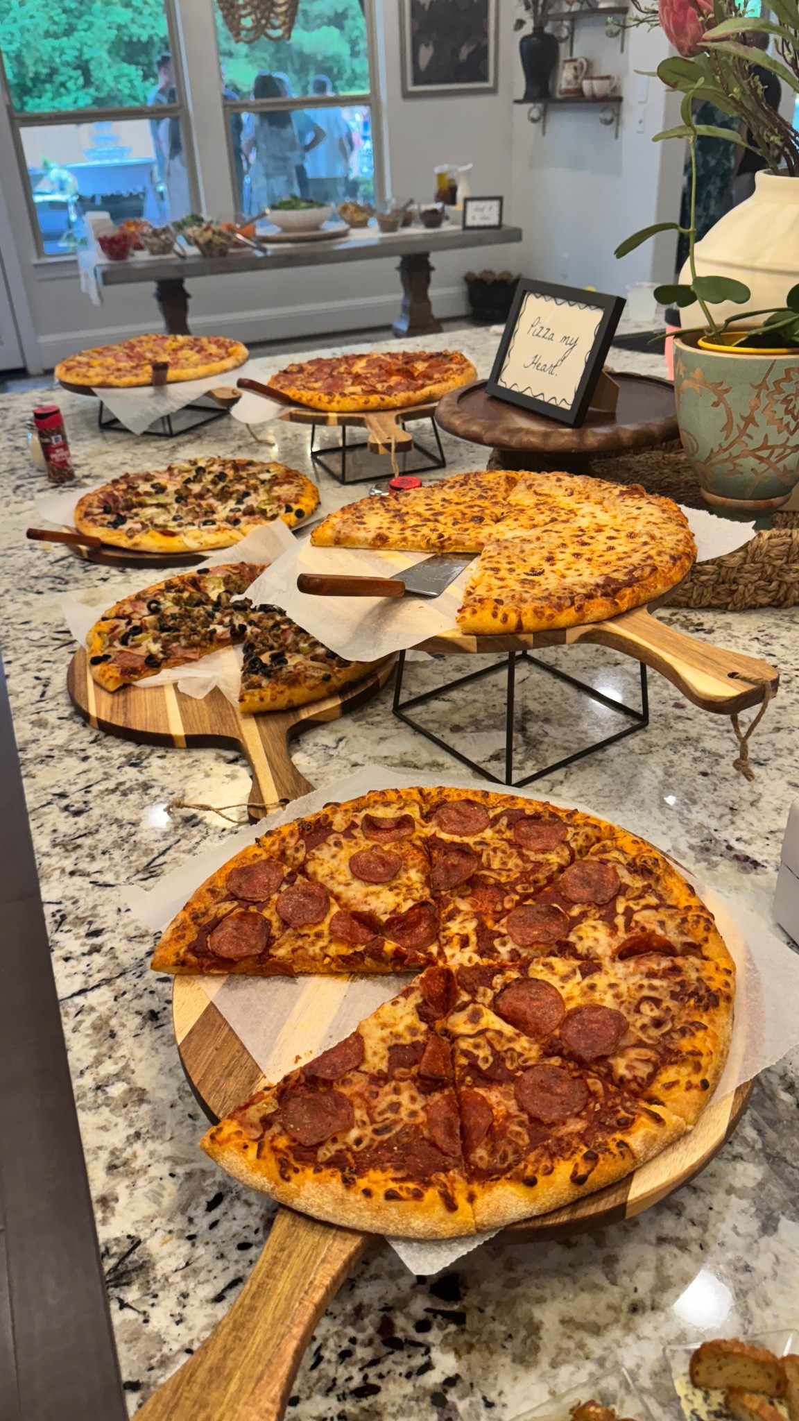Engagement party details - pizza bar! Used the cute custom boxes to store them on the side of the bar. Linked the pizza boards and stands! 🍕

#LTKParties #LTKWedding