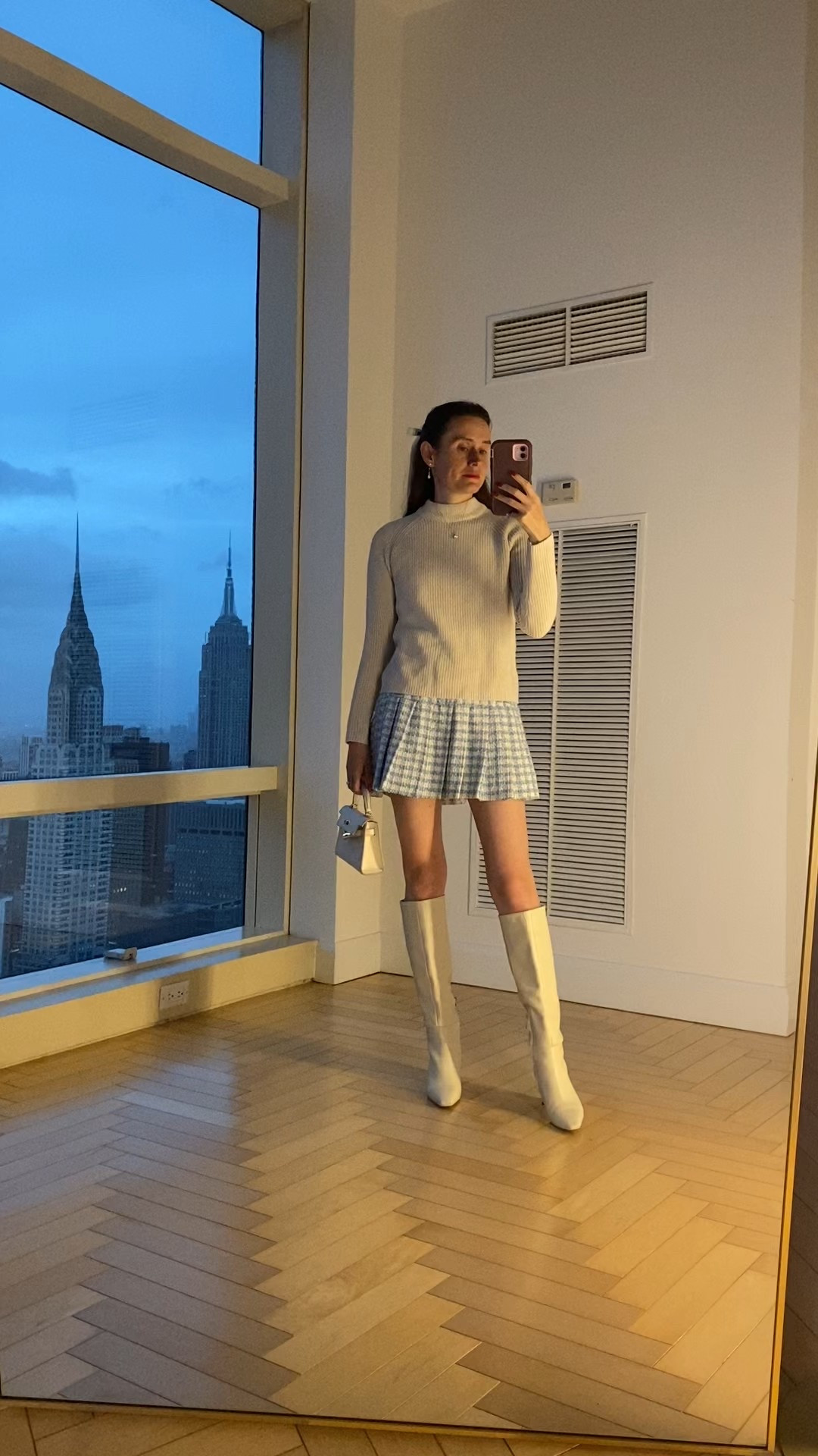 White boots, cream boots, cream sweater , tweed pleated skirt . Spring transitional style, nyc mom style 