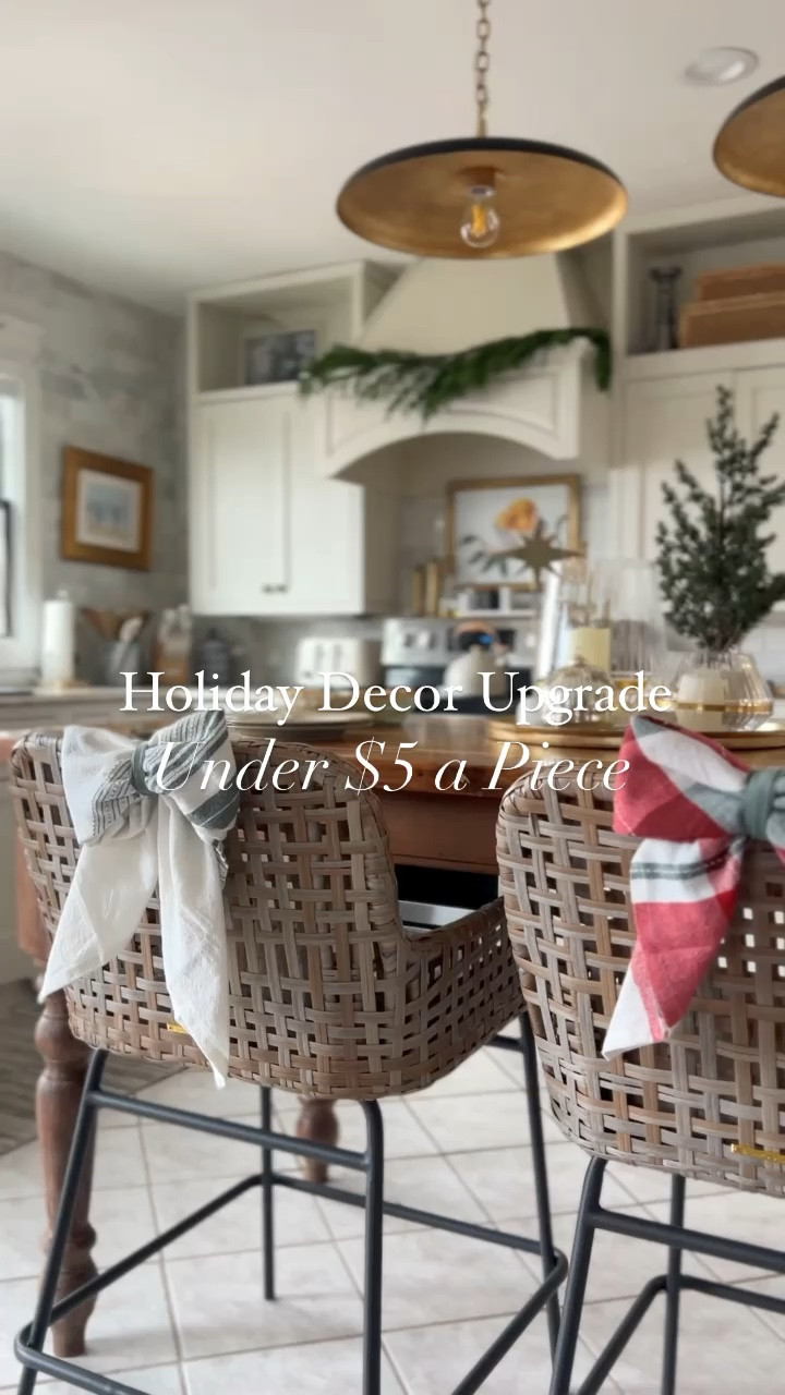Upgrade your holiday decor with a simple twist! 🎀✨ I folded a $3.99 tea towel into chic, oversized bows. These beauties are adorning my kitchen chairs and more, adding instant festive charm. It's easy, affordable, and oh-so-stylish! 