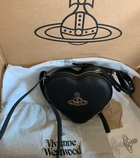Vivienne Westwood bag. Black heart shape, Louise mini bag. Faux leather, Orb logo plaque at the front. Wardrobe staple. Timeless. Gift guide idea for her. Farfetch, designer. Luxury, elegant, clean aesthetic, chic look, feminine fashion, trendy look, date night out. 

#LTKeurope #LTKparties #LTKitbag