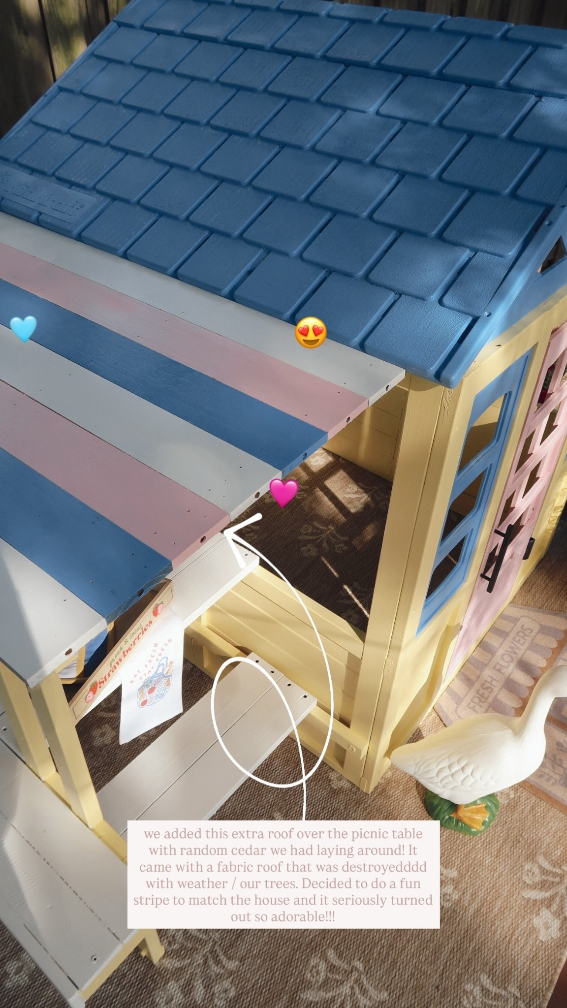 we added this extra roof over the picnic table with random cedar we had laying around! It came with a fabric roof that was destroyedddd with weather / our trees. Decided to do a fun stripe to match the house and it seriously turned out so adorable!!! 😍 🩷 🩵