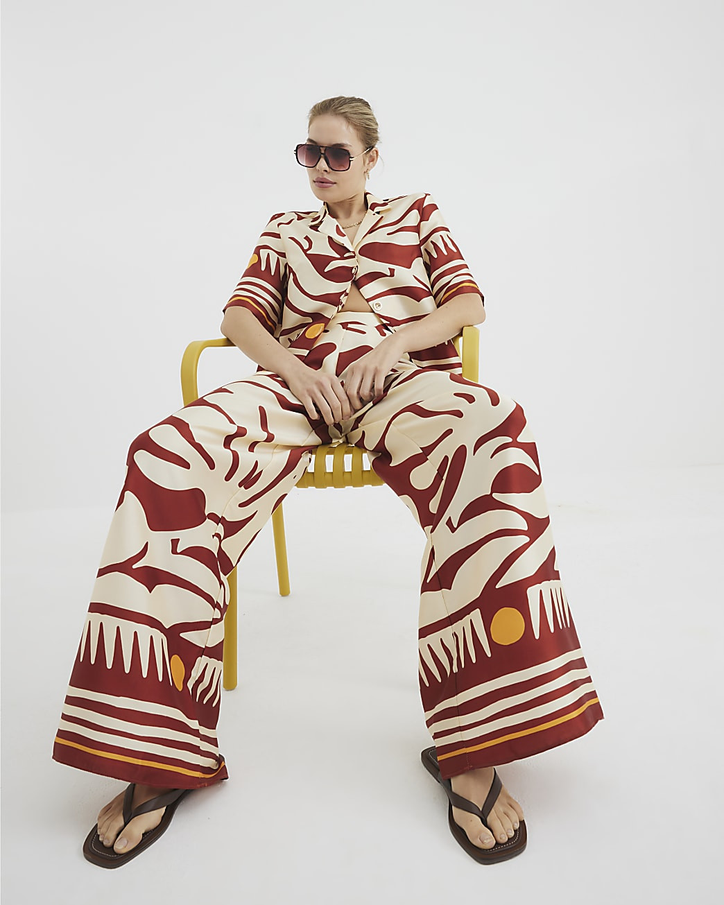 Rust Abstract Print Wide Leg Trousers | River Island UK & IE