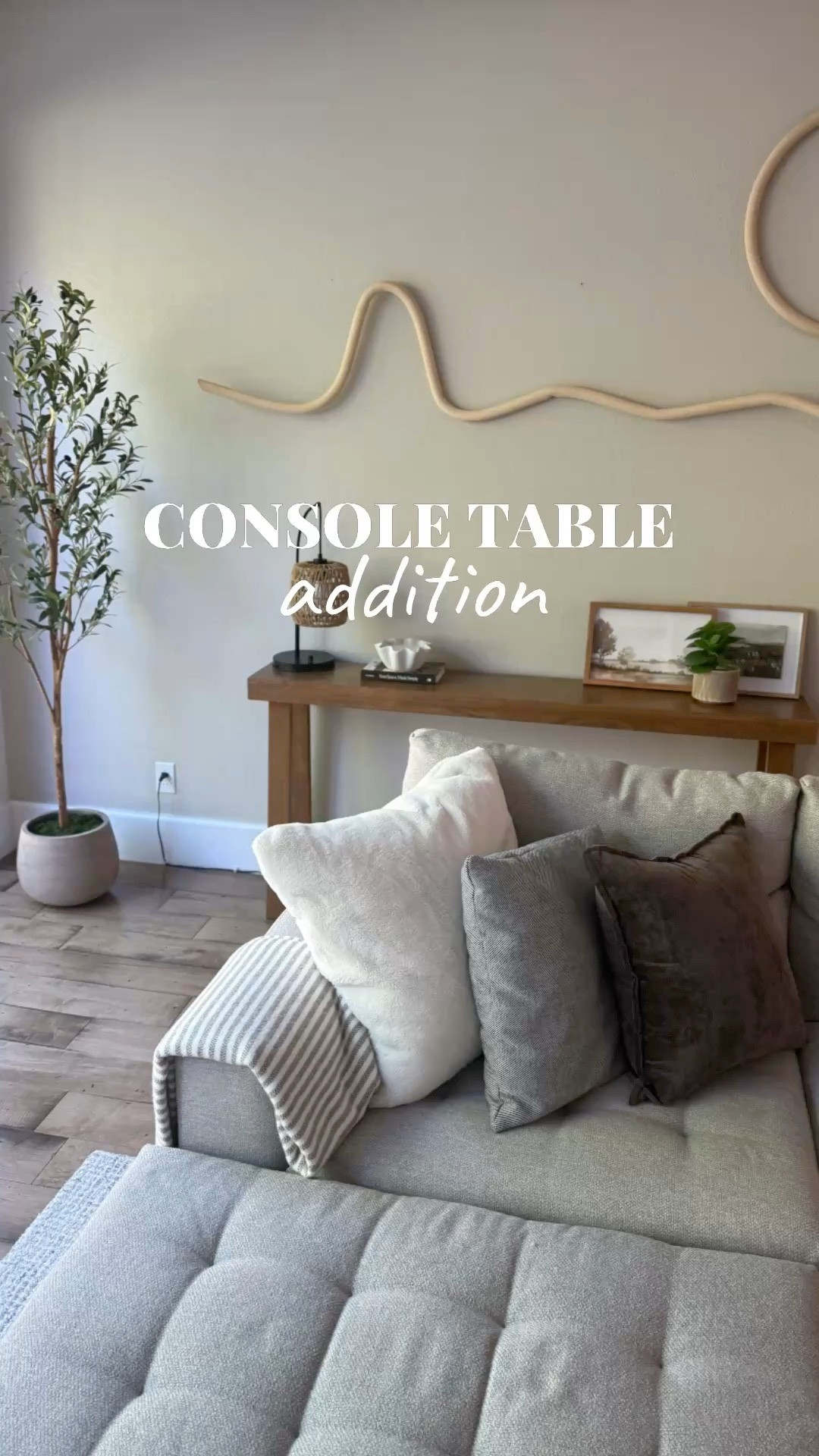 Layering a Stunning Living Room ✨ 

This living room was already beautiful, so the goal wasn’t to change it, it was to add depth and layers without taking away from the star of the room: the client’s unique nature-inspired wall art.

To complement the artwork instead of overshadowing it, I chose a simple console desk with clean lines. The tricky part? The space would only allow for a piece 12 inches deep or less. After some searching, we found this gorgeous Plank & Beam maple console desk, which fit the space perfectly.

To finish the look, I styled it with:
• A unique statement lamp
• Nature-inspired decor
• A 5-ft faux olive tree in a rustic planter for warmth and height

Designer Tip: I attach small cable clips to the back of console tables to hide lamp cords and keep everything looking clean and polished.

𝕃𝕚𝕟𝕜𝕤 𝕥𝕠 𝕊𝕙𝕠𝕡:
☞︎ All products used are linked below. ⬇️ 

✨ Thinking about refreshing a space in your home?
Send me a DM to schedule your complimentary consultation.

#beforeandafterhomeedition
#orangecountyhomes
#organizeyourhome
#homestylingtips
#interiorstylingideas 

#LTKHome