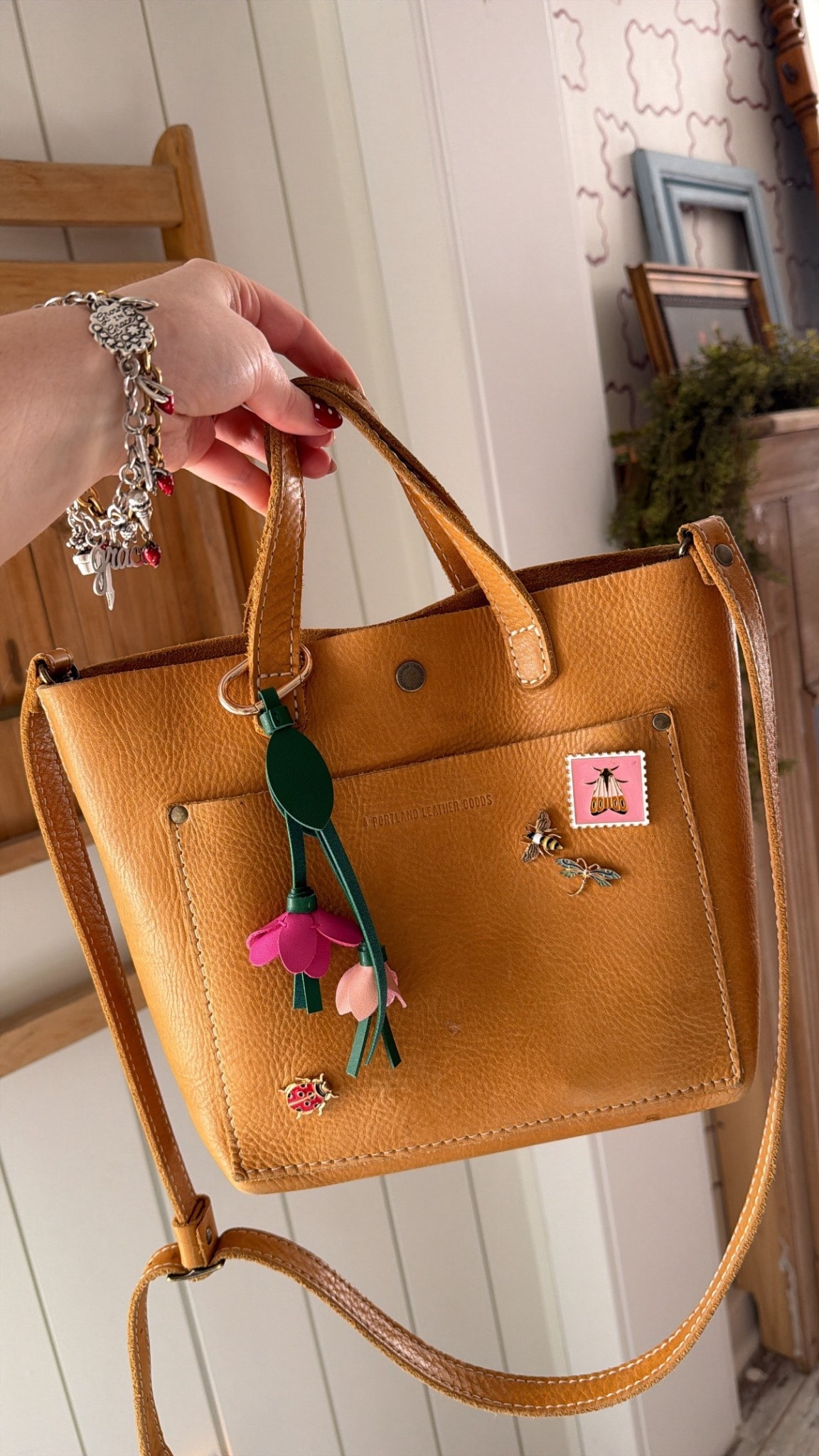 Cutest flower bag charm from old navy. They had so many cute options. Bag is Portland leather good. Have had for 6 years and still love 

#LTKmomlife #LTKFestival