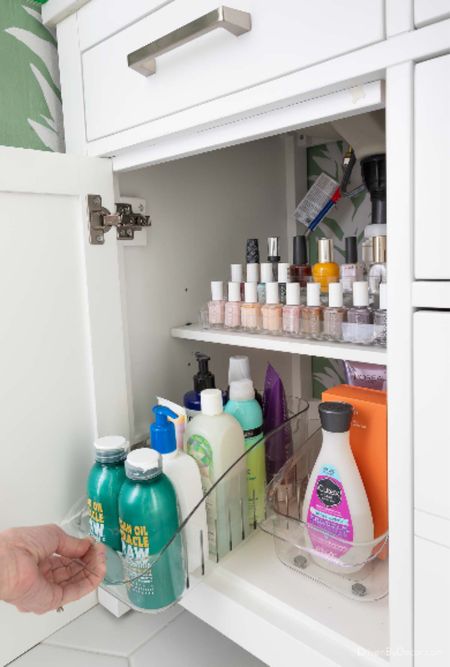Organizers in my bathroom vanity including a roll-out organizer for toiletries and a tiered organizer for nail polish bottles too!

#LTKfindsunder50 #LTKhome