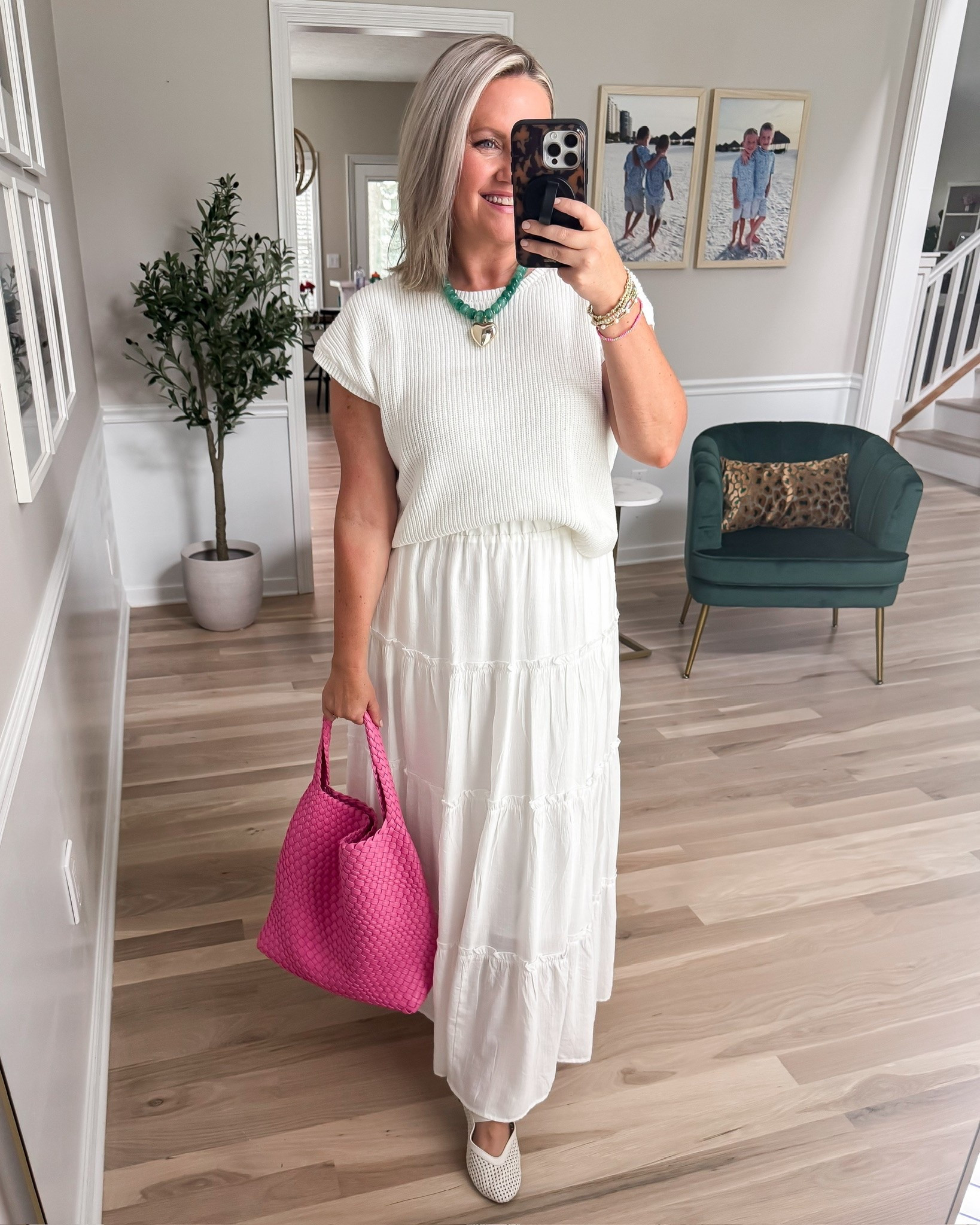This white maxi skirt has been such a good piece for stretching summer outfits into early fall. The lightweight sweater top adds a little texture without being too warm, and I love the bright pink tote and colorful necklace against all the white.

white maxi skirt, sweater top, monochrome outfit, transitional style, late summer outfit, pink tote, colorful accessories, lightweight knit, everyday fashion, lovelylifestyling

#LTKootd #LTKmomlife #LTKWorkwear