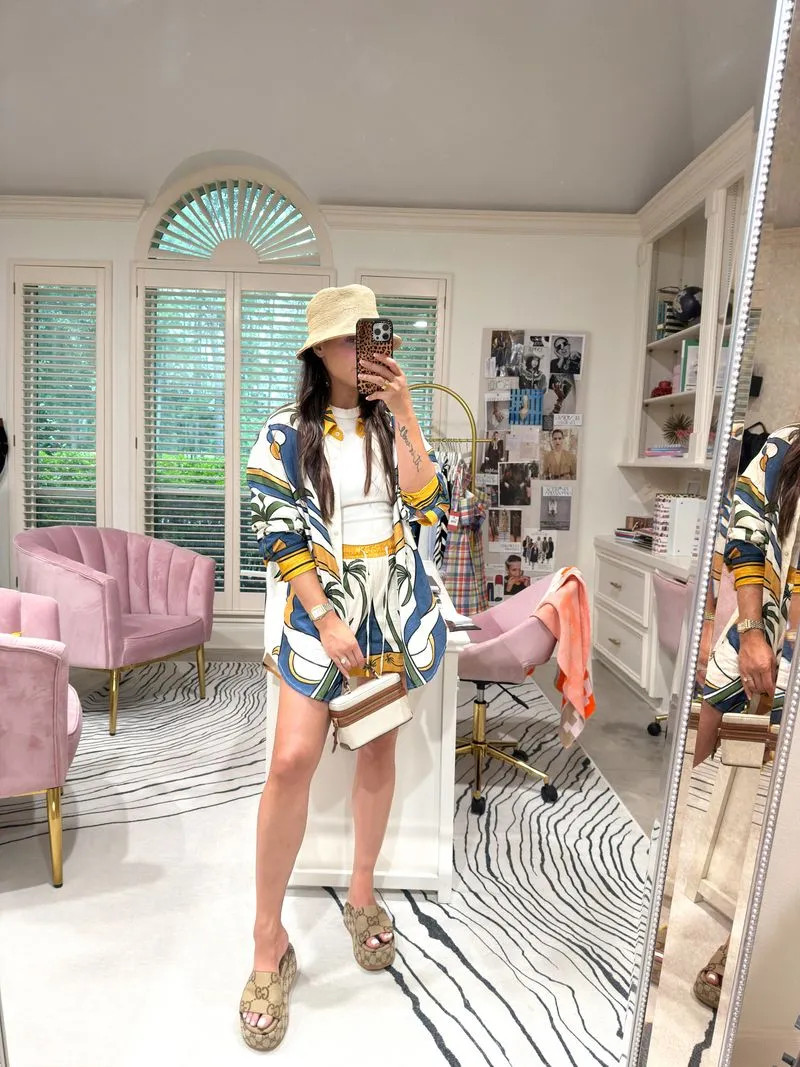 Farm Rio said "wear the whole print or nothing" and I listened. Matching sets are the easiest way to look put-together before 9am — throw on the shorts and shirt, add slides, done. The oversized shirt does the job a jacket usually does (hides what you don't want seen, hides what you do want seen too, no in-between). Gucci slides because comfort and status don't have to be enemies. Bucket hat because I didn't do my hair today and that's between me and the mirror. 

 #LTKootd