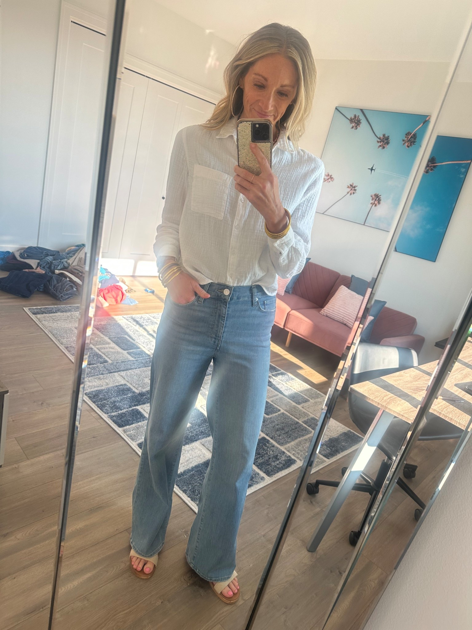 Seriously obsessed with this loose white top and wide leg FRAME jeans! 

#LTKStyleTip #LTKOver40 #LTKMidsize
