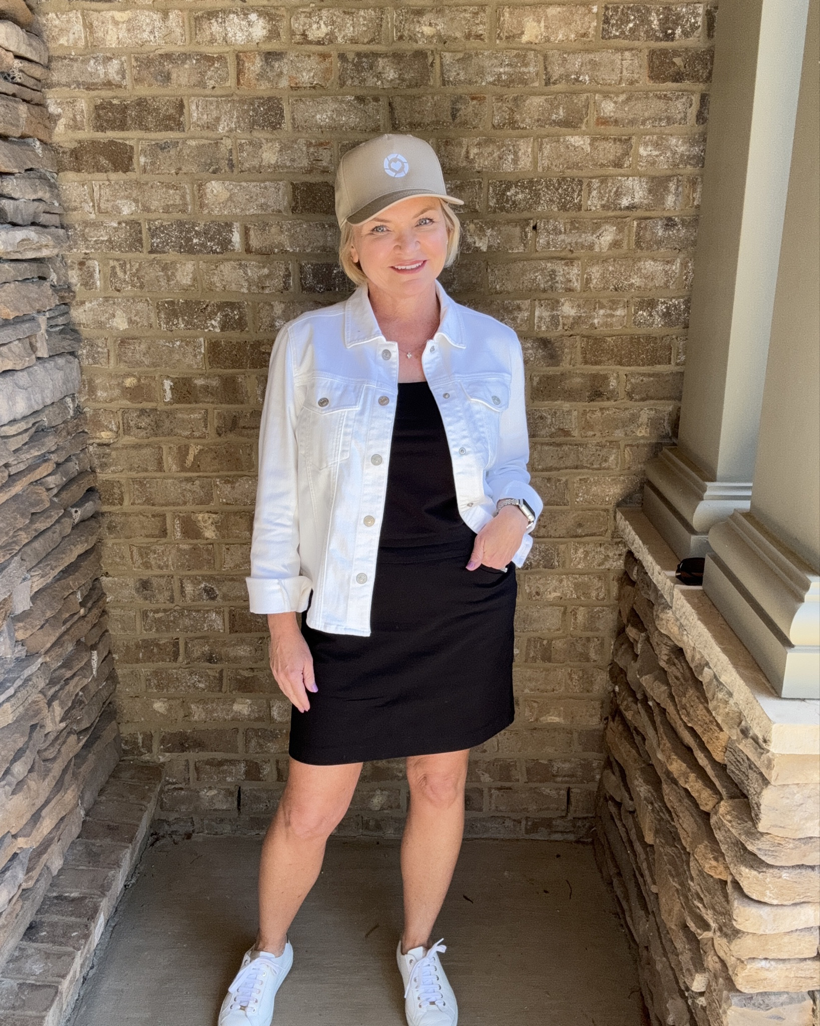 Proud to be an LTK Creator! And loving this outfit for a bright & sunny Spring day! 😎 
The black tank & skort look like a dress but are stretchy, comfy separates and the white denim jacket is the perfect layer for cool mornings (or too cool air conditioning!)

Wearing small jacket, tank & skirt.  

Spring outfit
Summer outfit
Spring dress
Travel outfit
Denim jacket
Sneakers
Petite


#LTKfindsunder100 #LTKover40 #LTKstyletip