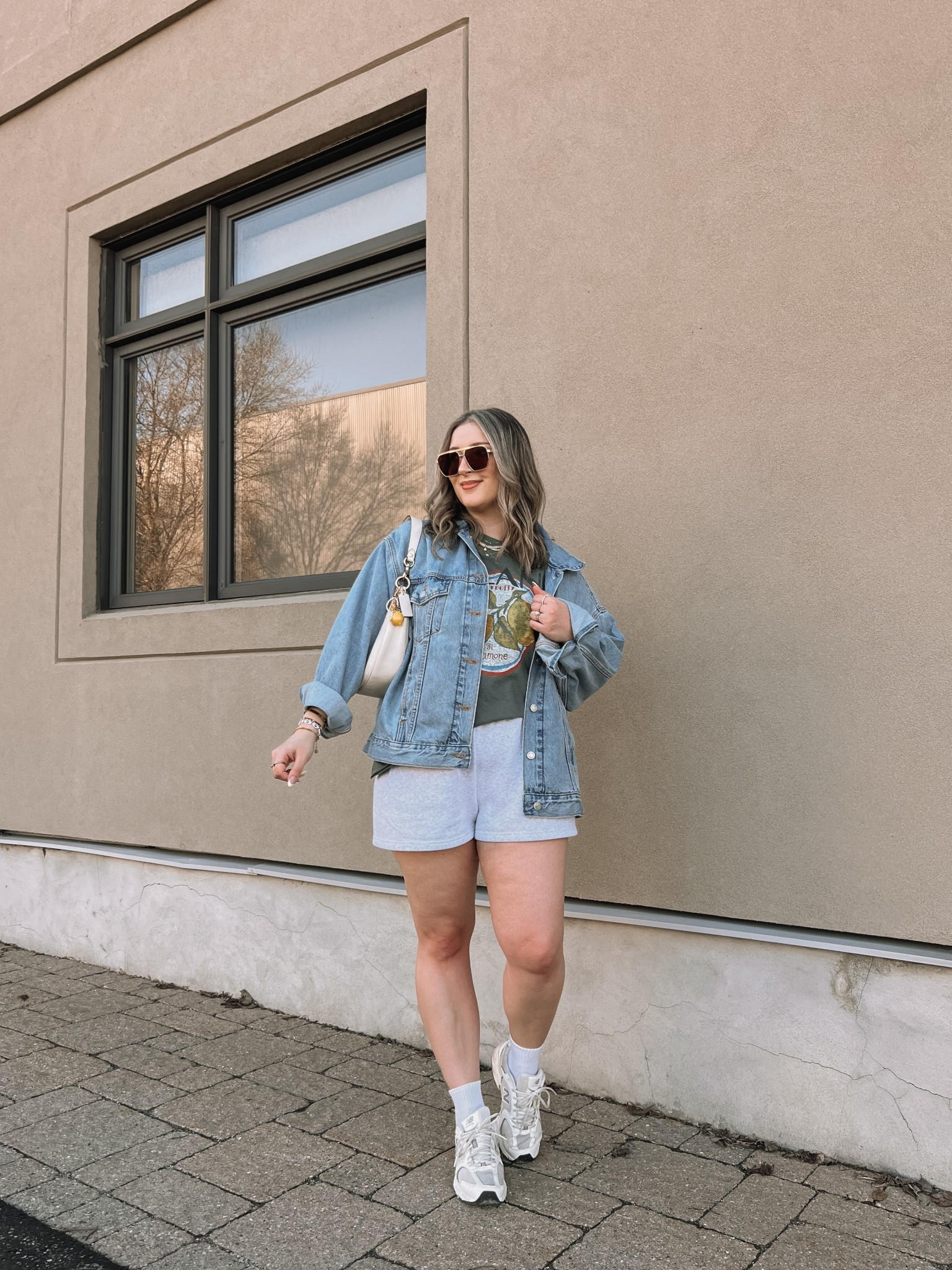 Comfy casual Spring ootd! Wearing my usual size L in the sweatshorts and graphic tee. Sized up to XL in the denim jacket, also linked similar. New Balance dad sneakers run a little big, I’m a 9.5-10 and wear a 9

#LTKmidsize #LTKsale #LTKsummer