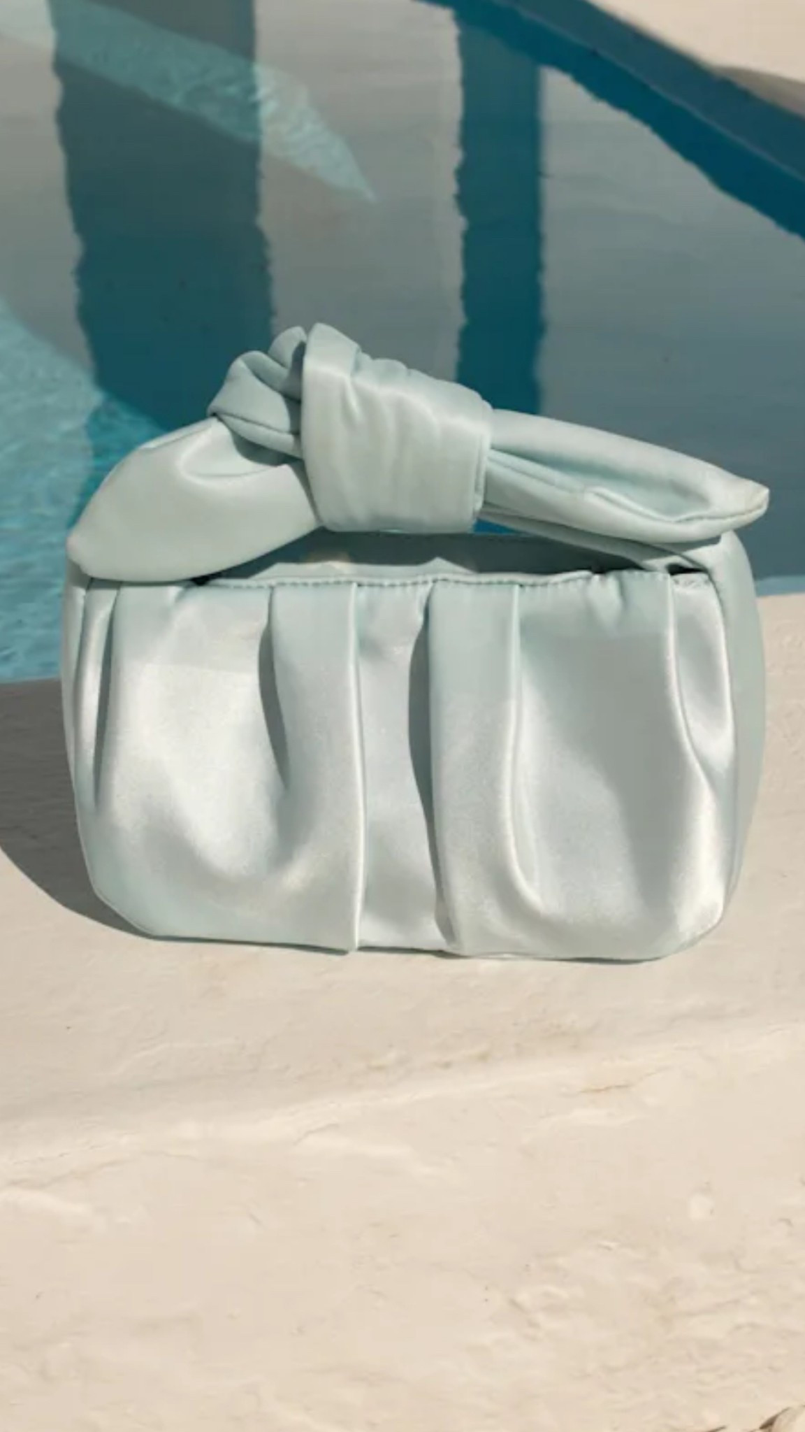 Light blue satin knot bag

#LTKFindsUnder100 #LTKWedding #LTKItBag