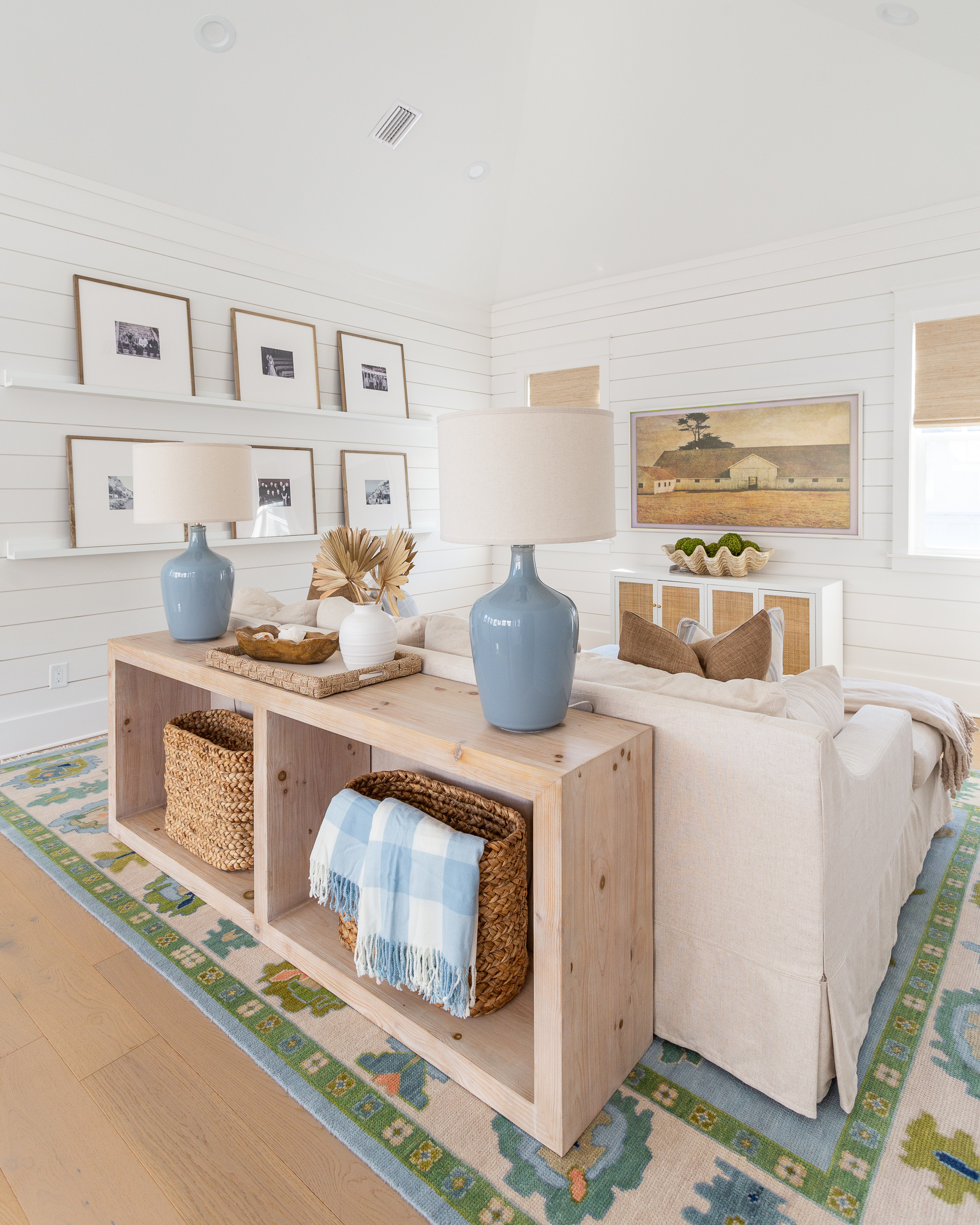 modern loft decor // coastal loft decor // console table // rug // coastal vase  

 #LTKSeasonal #LTKHome