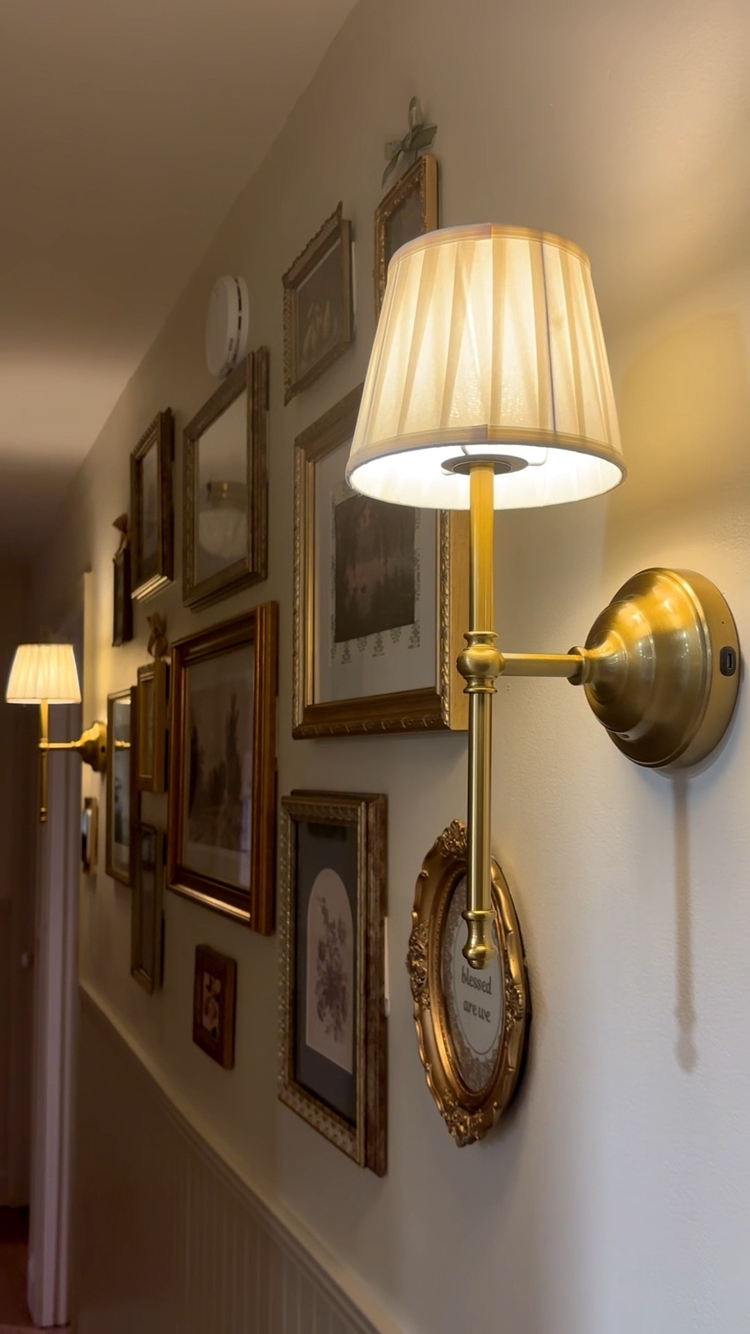 Our cozy hallway glow-up 🤍
These @amazonfindsandfashion  battery sconces gave us that warm vintage lighting without hardwiring, and I’m also linking some vintage-style frames if you’re dreaming of creating your own collected gallery wall.

Everything saved here for easy inspo ✨

#LTKdayinmylife #LTKmomlife #LTKSeasonal