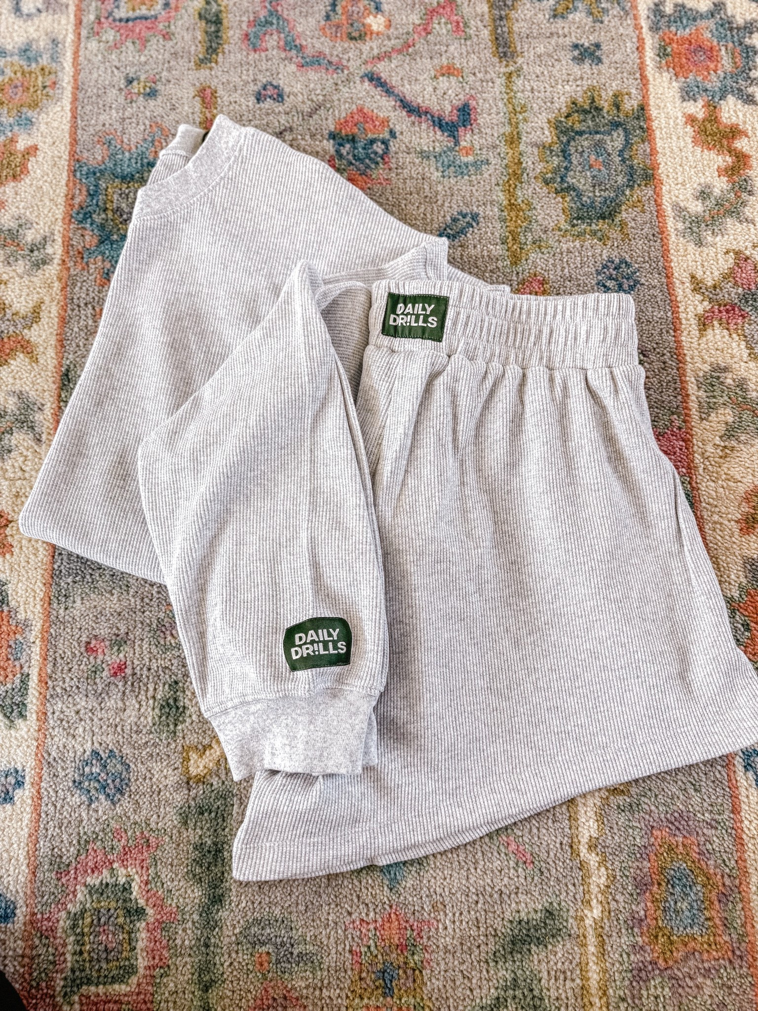 Daily Drills gray waffle set // im a size 6/8 and I did xs/s top & m/l shorts. Very oversized & fits great! 