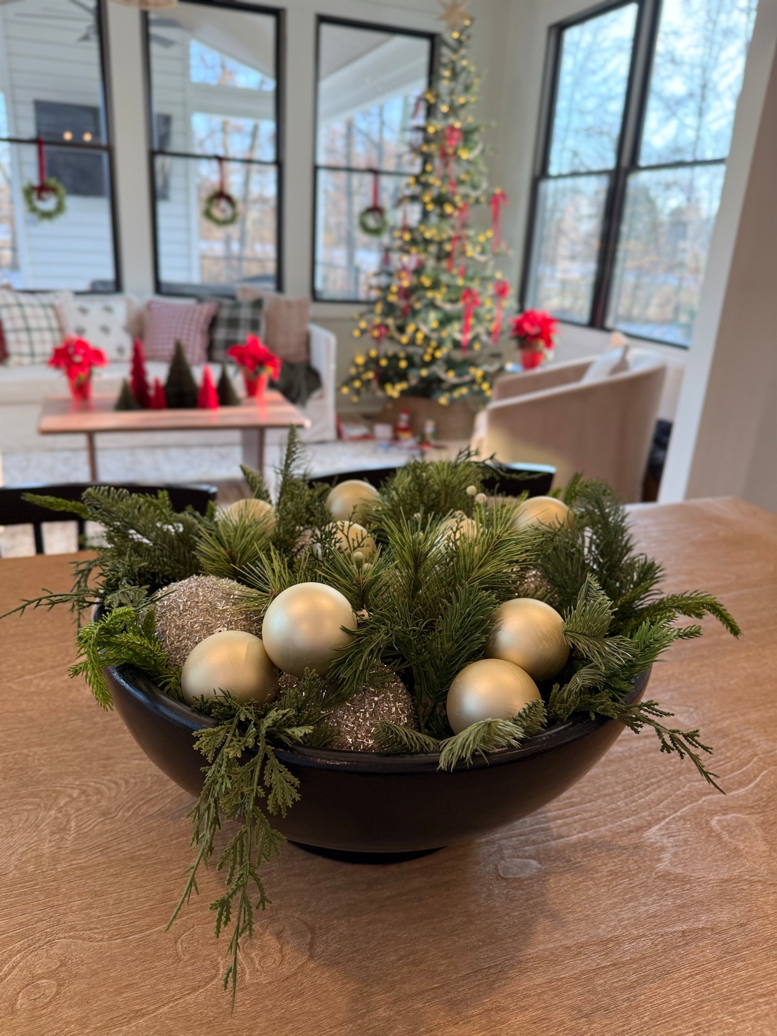 Super easy Christmas centerpiece! I broke down a bunch of different greenery stems and added some ornaments and love how it turned out! Also tagging my decor in the sunroom featured in the background! 🎄🎄

#LTKHome #LTKSeasonal #LTKHoliday