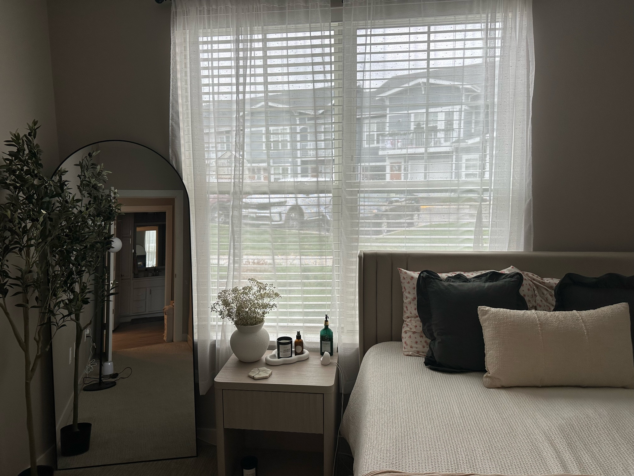 Bedroom upgrade is almost complete 💗 new mirror, olive tree, nightstand, & bedding! 

#LTKHome #LTKFindsUnder50