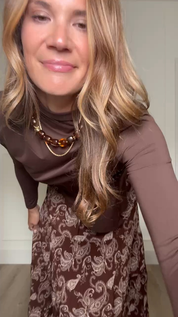 This skirt was made for fall plans. The rich brown paisley print has so much movement, and pairing it with a simple chocolate top and pointed boots lets the skirt be the focus.

Fall skirt outfit, Paisley midi skirt, Chocolate brown outfit, Tall girl fashion, Tall friendly clothing, Midi skirt outfit, Fall date night, Brown boots, Feminine fall style, Fall outfit ideas, Autumn colors, StangandCo

#LTKootd #LTKTall #LTKSeasonal