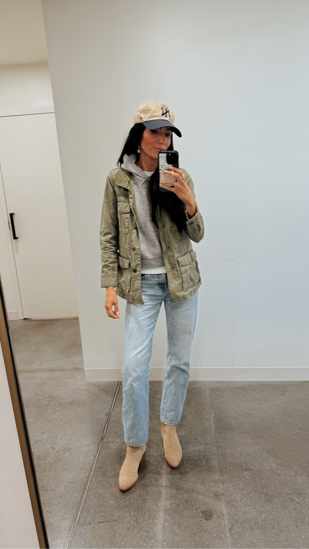 False spring has me dressing like it. 🤍 Layered a military jacket + hoodie and added charms to my classic hoops. Linking in LTK.