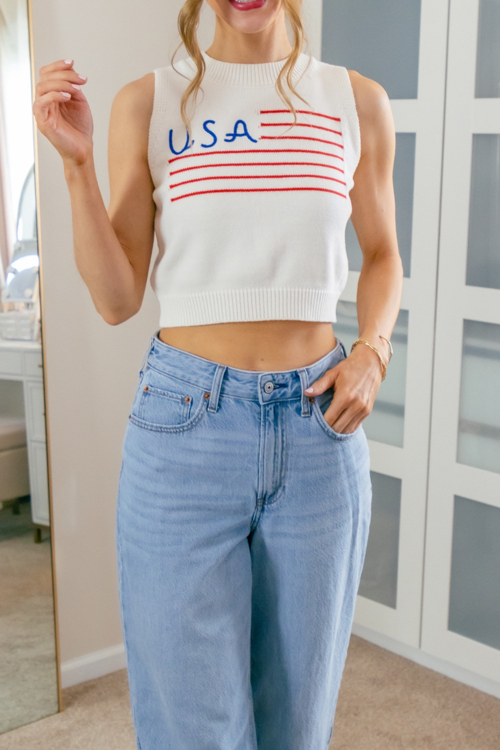How is MDW only a week away already?!
Feeling the summer vibes with this fun crop tank and wide-leg jeans combo. Perfect for a casual / festive celebration or a 4th of July outfit! 
>>>I'm in a size medium in the white color option in the USA tank top.
 

 #LTKootd #LTKSeasonal #LTKOver40