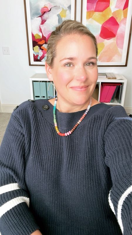 I have been living in this Walmart sweater!!! Super flattering. I’m wearing a size extra-large, which is TTS for me. Roomy fit. Boat neck sweater, navy and white sweater, rainbow necklace 

#LTKstyletip #LTKunder50 #LTKSeasonal