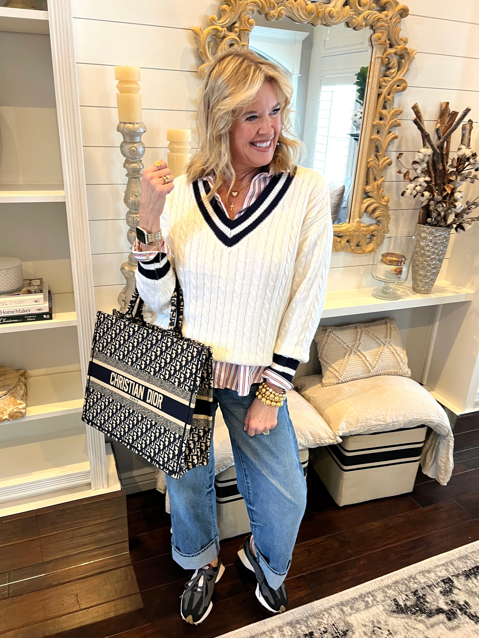 Outfit of the day 
Spring preppy vibe!

Kut from kloth wide leg high waisted large cuff jeans tts

Stripped button up 

V neck white sweater with blue stripe v neck

New balance shoes. 327

Dior tote 

Lisi lurched bracelet stack#LTKMostLoved

#LTKstyletip #LTKover40 #LTKfindsunder100