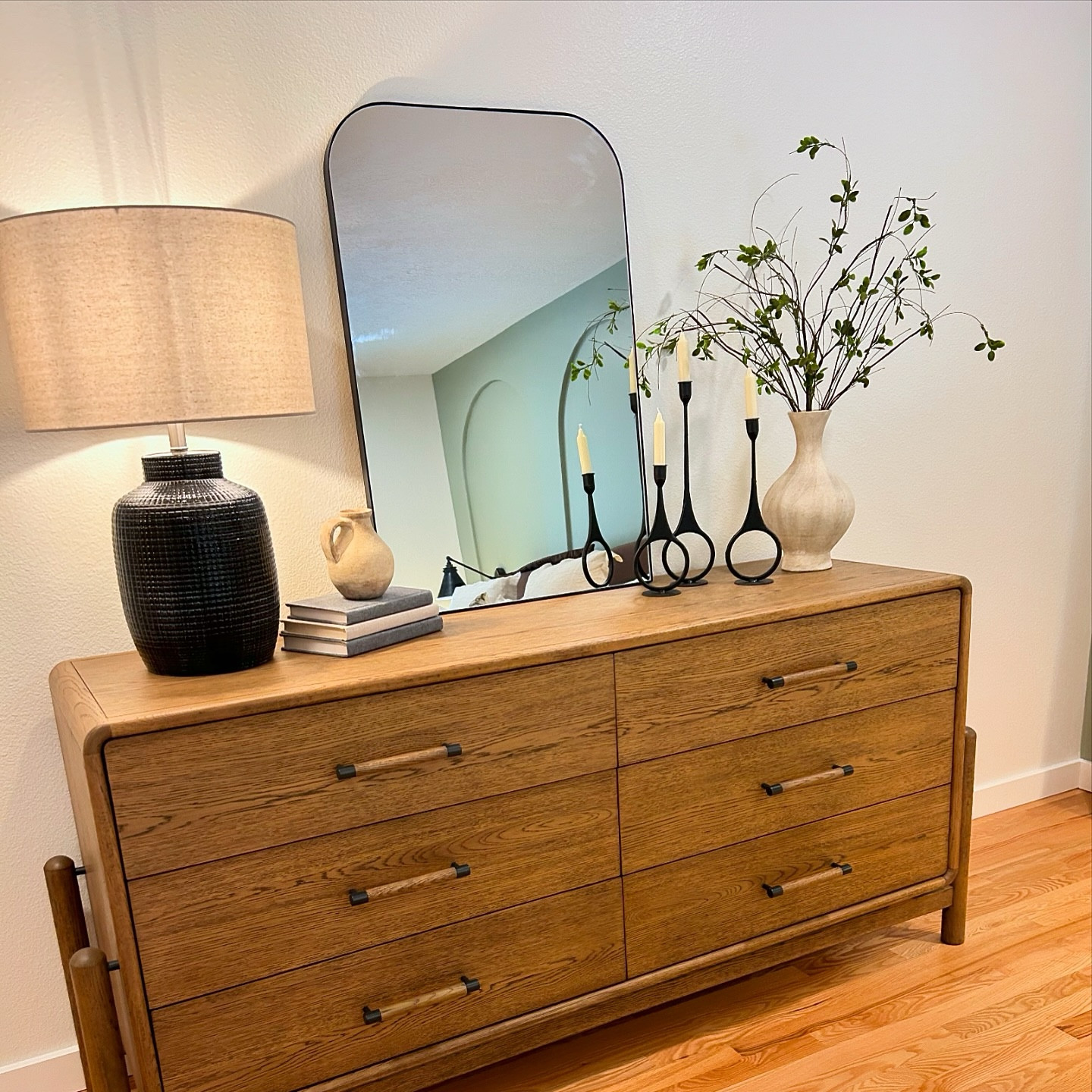 Still beaming about the unveiling of this space for our clients!

For this master bedroom design, we transformed the space into a serene, luxurious retreat with this standout feature: 

💫 Custom Wall Arch Inserts: These architectural elements add depth and dimension, creating a visually striking focal point. Each arch is carefully designed to blend seamlessly with the room’s aesthetic, adding both elegance and functionality.

The arches subtly frame the bed, drawing the eye to the heart of the room while creating a sense of intimacy. Soft, ambient lighting within the insets enhances the room’s atmosphere, making the space feel warm and inviting. This remodel not only upgraded the bedroom’s design but also introduced a timeless feature that elevates the entire look and feel of the space.

The look is completed with a gorgeous dresser, two nightstands, eye catching light features, cozy on your toes tasseled rug and more! 

If you’re curious about where we sourced some of the pieces in this project, we’ve shared the details on our LTK page (link in profile). Feel free to check it out for more information on the items we used to bring this space together!

#jkehomereset #jkehomeorganizing #interiordesign #archwall #designer #boisedesigner #djericrhodes #masterbedroom #masterbedroomdesign