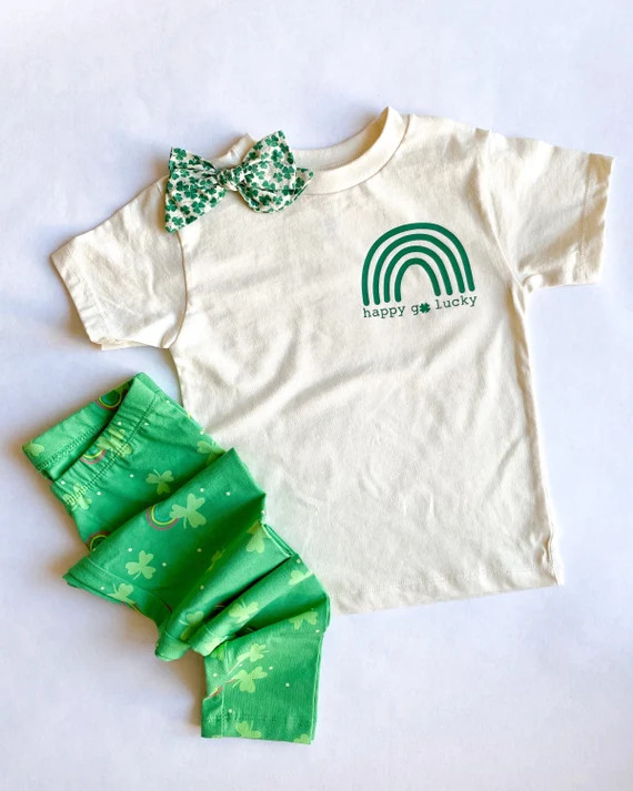 Kids unisex st Patrick’s day shirt | Happy go lucky rainbow toddler and kids shirt | natural st... | Etsy (US)