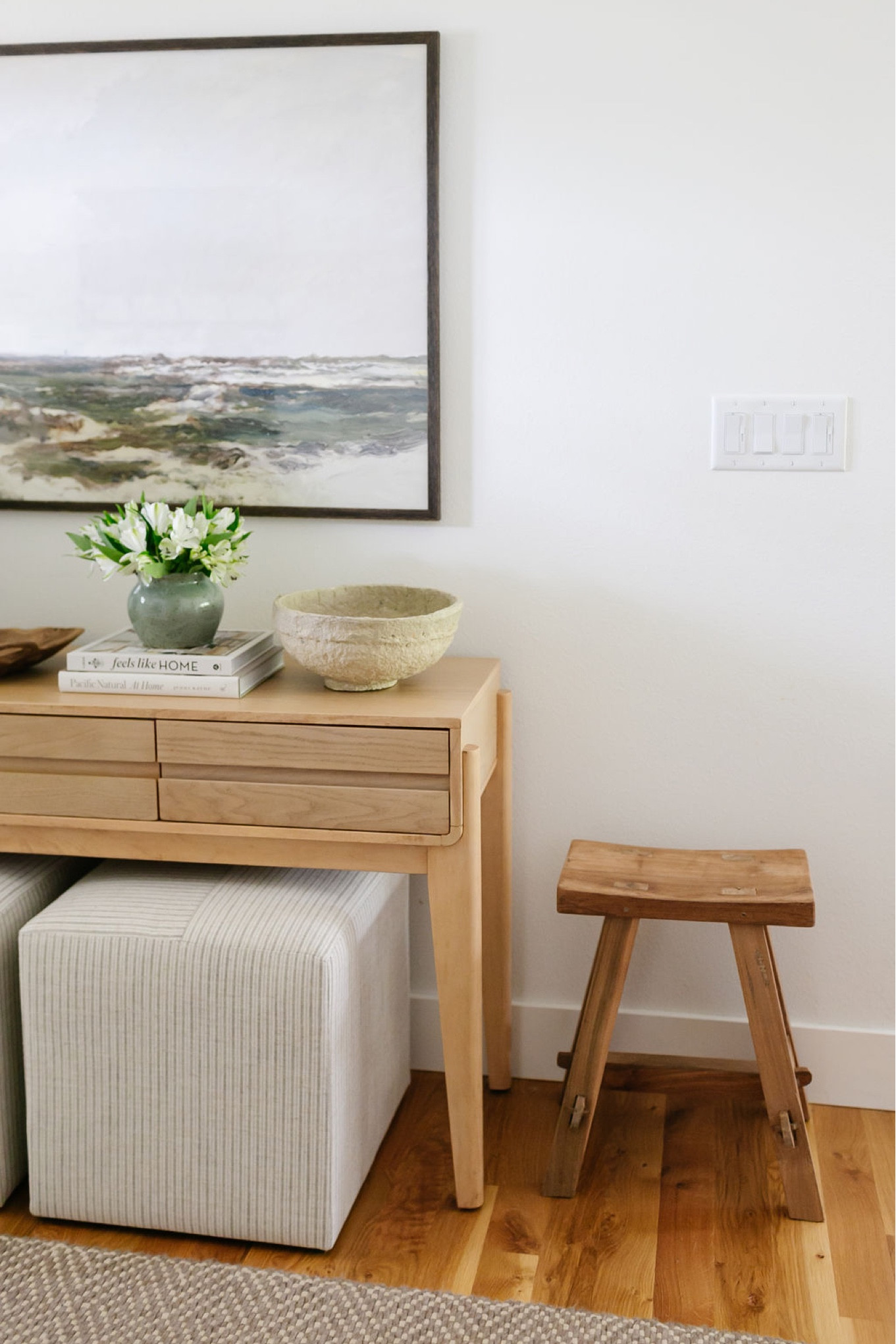 My entryway includes this Target console table with upholstered cube ottomans and a wood stool. Above it is an oversized piece of artwork  

#LTKhome #LTKstyletip #LTKFind