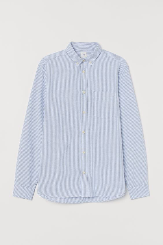 Shirt in woven cotton fabric. Button-down collar, buttons at front, and yoke at back with locker ... | H&M (US + CA)