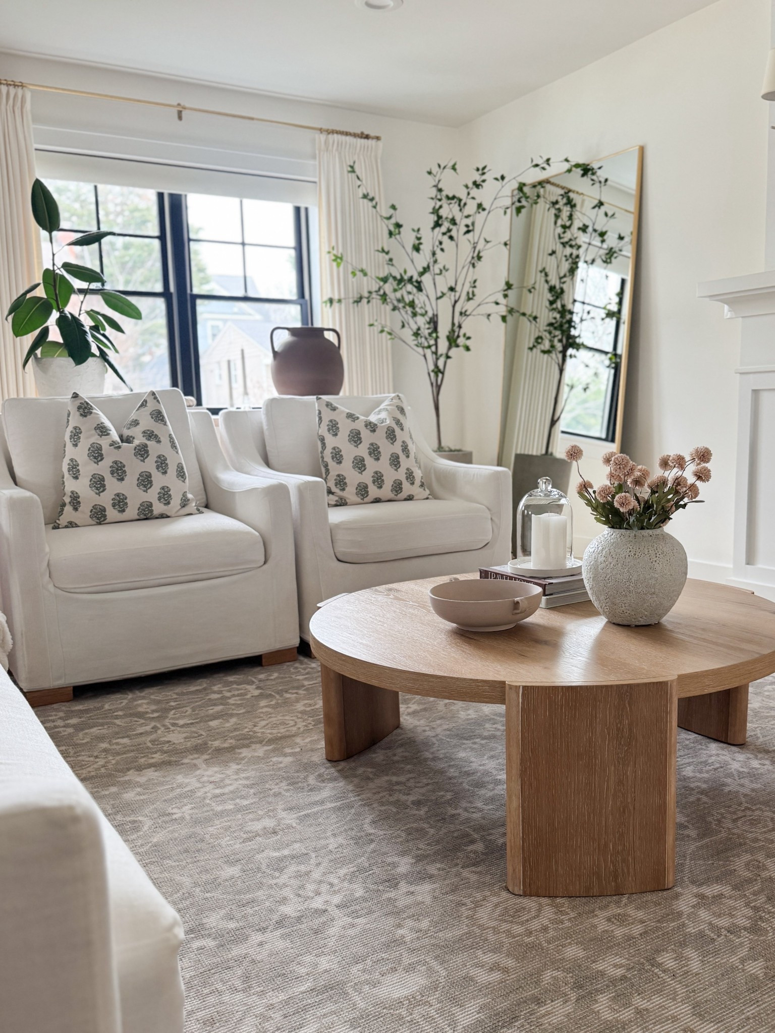 Neutral living room with pips of green. Round light wood coffee table. Home refresh inspo. 

#LTKSaleAlert #LTKHome #LTKFindsUnder50