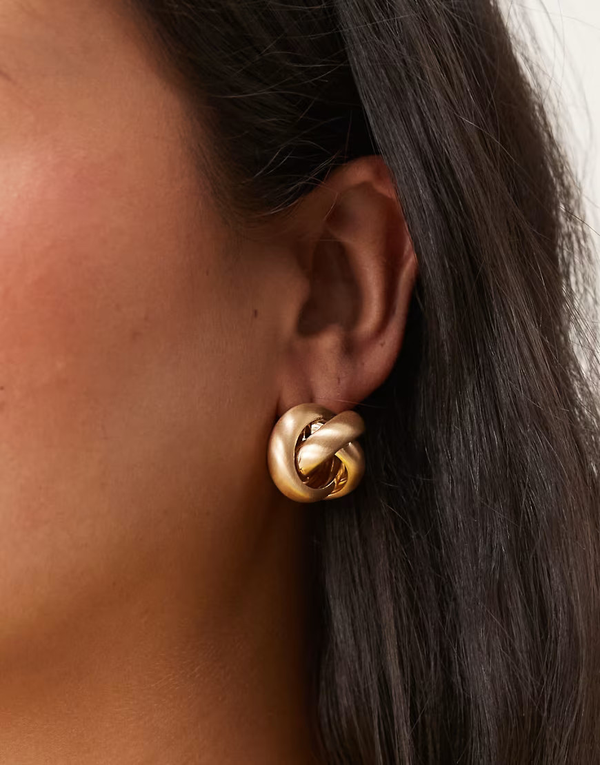 ASOS DESIGN stud earrings with circular knot detail in brushed gold | ASOS (Global)