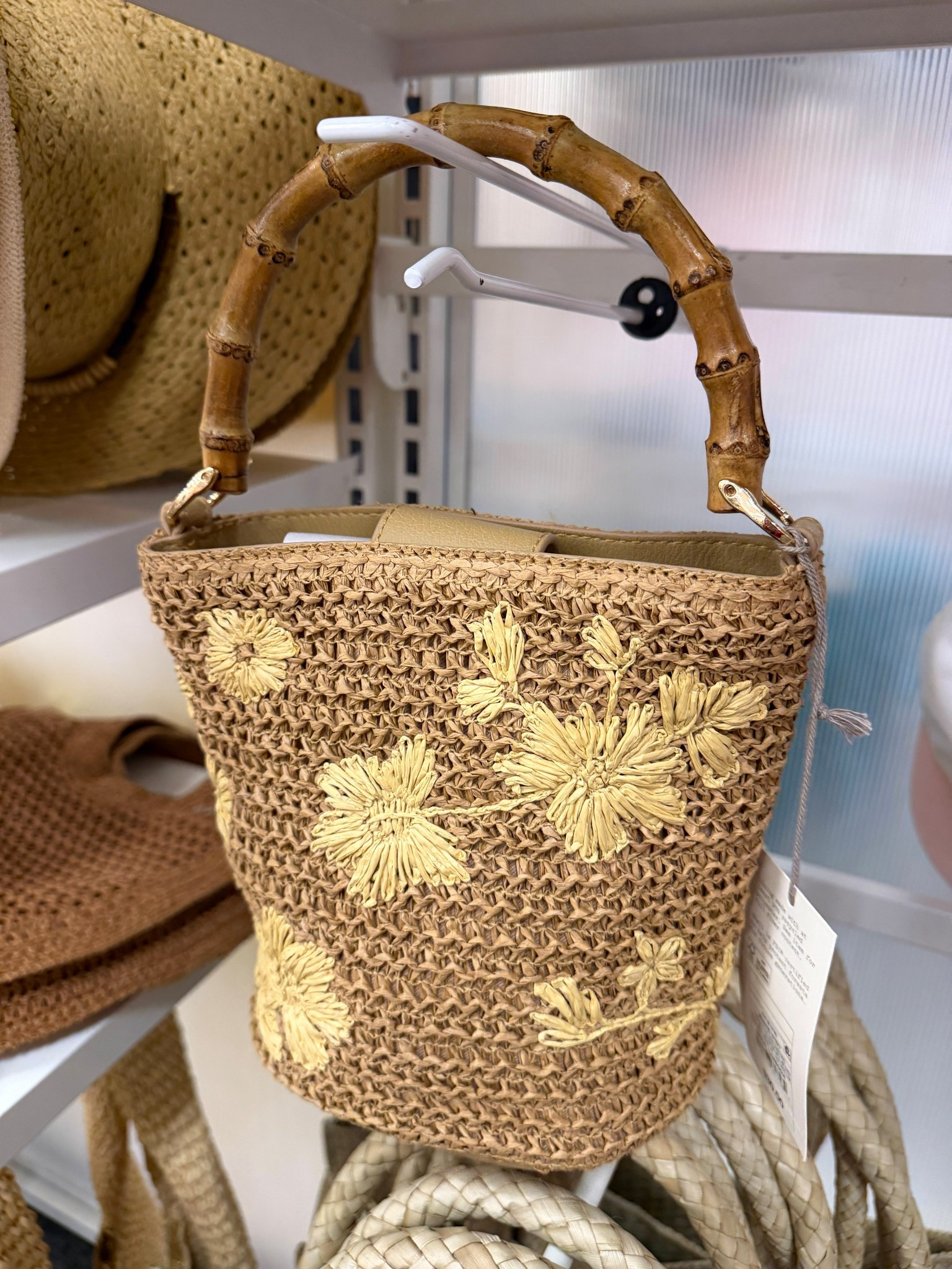 New at Target and she’s cute! 🎯 The Straw Floral Embroidered Bucket Top Handle Bag from A New Day is instant summer chic with its sweet embroidered details and that faux bamboo handle (so good 👏). Lightweight, polished, and easy to dress up or down—perfect for brunch, beach trips, or summer nights out. 🌼And at $30, it’s such a fun affordable find! 😍 #TargetFinds #SummerBag  #VacationBag

#LTKSeasonal #LTKootd #LTKSaleAlert