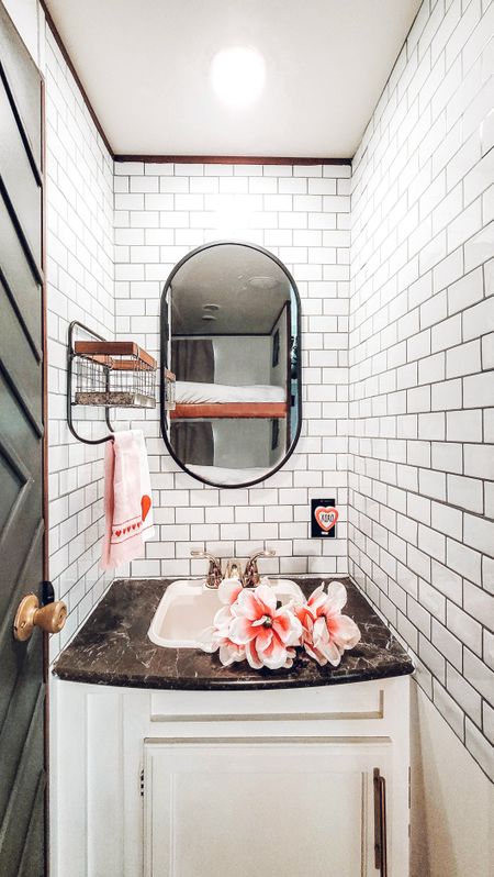 Revamped our camper bathroom with a touch of style using peel-and-stick tiles for an easy interior design upgrade #interiordesign #rusticdecor #peelandstick 

