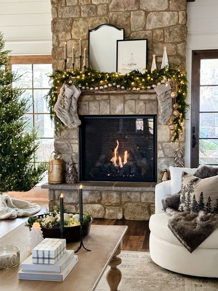 One of my favorite holiday views😍

Mantle decor | stone fireplace | swivel chair | coffee table decor | Christmas tree | pottery barn

#LTKSeasonal #LTKHoliday #LTKhome
