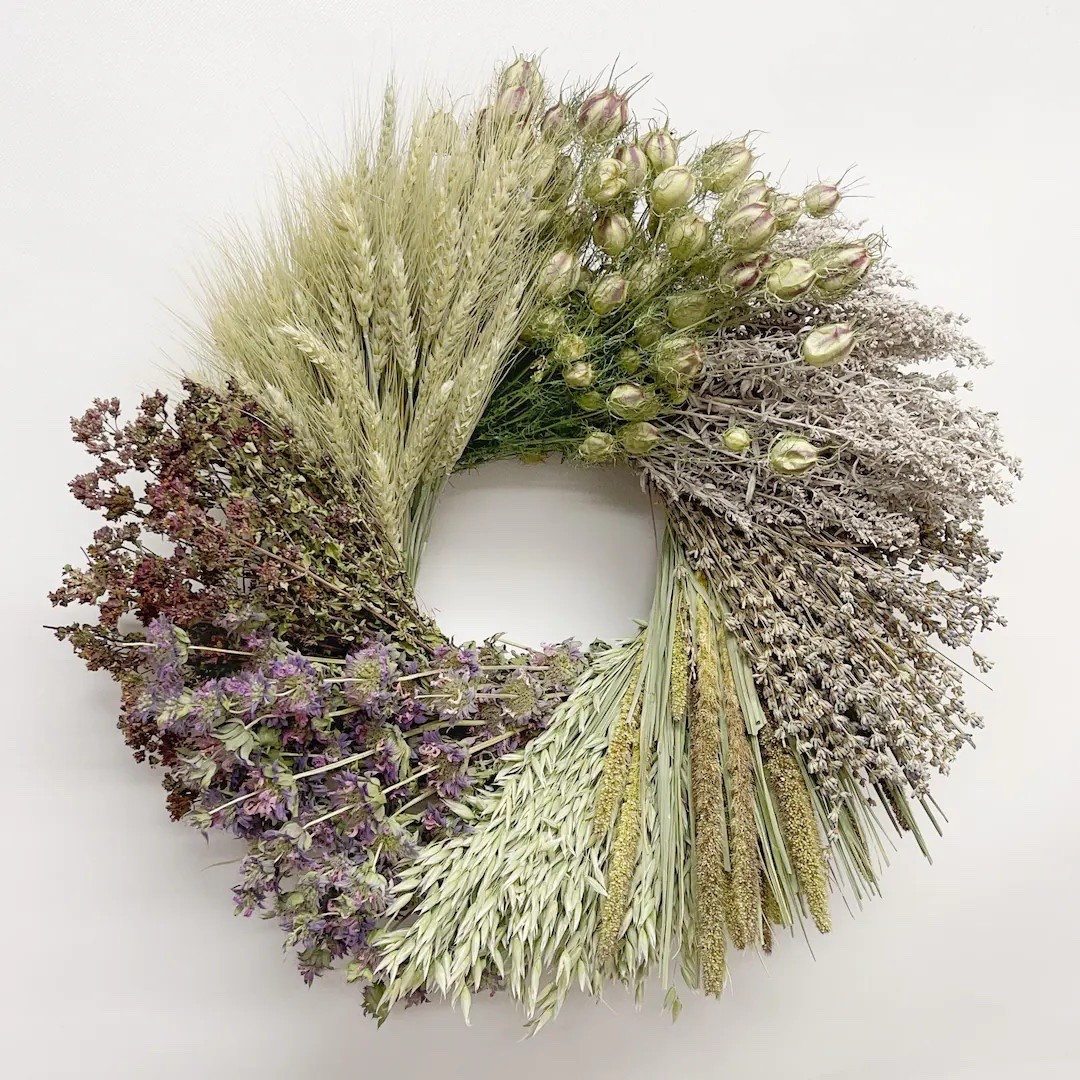 A wreath that feels like a bundle of herbs and grains gathered straight from the garden 🌿 Made with air-dried wheat, avena oats, millet, lavender, lemon mint, nigella, oregano, and silvery artemisia, this natural arrangement has a soft, cottage-inspired charm. The blend of herbs and grains creates beautiful texture and a calm, earthy palette that fits perfectly with farmhouse or nature-inspired decor. Each wreath is grown, harvested, dried, and handcrafted on a U.S. farm, making every piece truly one of a kind.

#ltkhome #driedflowers #farmhousedecor #cottagecore #herbwreath #naturaldriedflowers #rusticdecor #gardeninspired #homedecorinspo #ltkfinds

#LTKSpringSale #LTKSeasonal #LTKHome