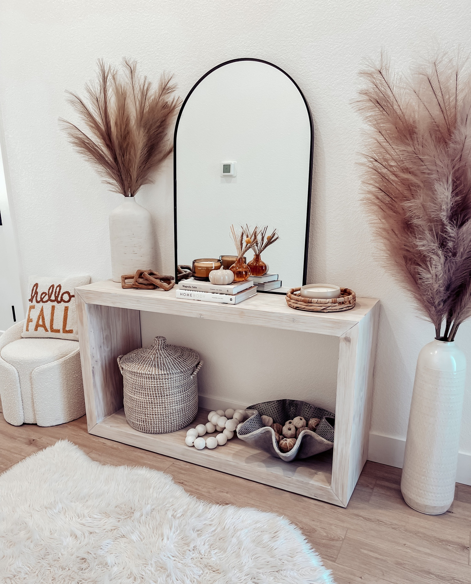I finally found a console table for our entryway! I’m so happy with it. It’s been empty since we moved in and its so nice having something in the space now! 😁 This one is from @jossandmain and I was so impressed with the shipping. I ordered in Sunday evening and it arrived this afternoon (so 2 days)!! I’ve been waiting for my other furniture for months and it still hasn’t arrived or is even close to arriving. 😑 So if you’re looking for furniture and don’t want to wait half a year I would highly recommend checking out Joss and Main. The price wasn’t terrible on this one compared to other places I’ve been looking either. It has a matching coffee table too! It’s out of stock now but will be back in stock Oct. 2nd. 

I’ve included most of the decor on my ltk post so just download the free LTK app and screenshot this picture or just follow me on there! It will email you all the links to shop this post. 

My boucle stool is on sale right now from $419 down to $299! It’s so cute and cozy and the perfect spot to put your shoes on! 

I love this basket for storing shoes or hats or whatever. It’s nice that you can cover the mess with the lid too! They have a big one as well which is fab for storing blankets. 

The pampas is on sale right now. Both sizes! They have lots of different colors. 

And the candles smell amazing! 🤩 I couldn’t find the reed diffuser online but it’s Amber Cardamom and it’s so yummy and it’s from World Market. I just got it so just go into your local store! 



#LTKSeasonal #LTKhome #LTKsalealert