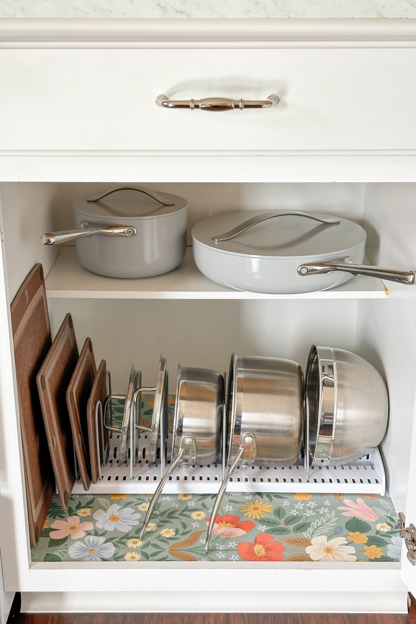 One of my organizing goals for 2025 was to tackle our pots and pans. I found the perfect rack from @wayfair to use in our cabinets! #wayfairpartner To make the cabinet a little more cheerful, I also added this peel and stick wallpaper to the bottom. It would look great in the back of a cabinet for mugs or glasses too! Shop more cabinet organization finds from #wayfair below.

#LTKHome #LTKFamily #LTKSeasonal