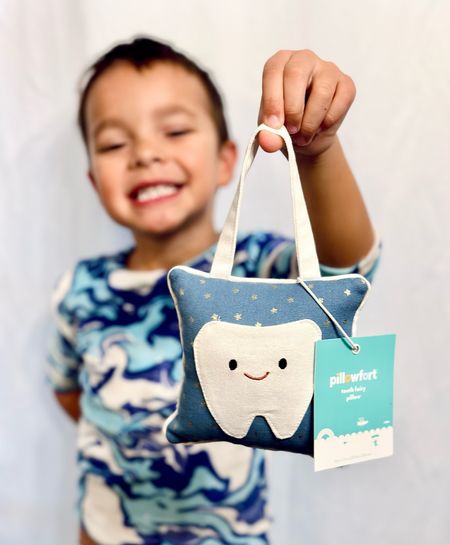 We have our first loose tooth 🦷 so we are now prepared for the tooth fairy with this adorable pillow by pillowfort! The tooth is a little pocket 😍 and 𝙗𝙤𝙣𝙪𝙨 it can hang on their door or next to their bed 🙌🏽👏🏽 so you don’t have to worry about them waking up!! 

❤️ Follow me on Instagram @TargetFamilyFinds 

#LTKFind #LTKfamily #LTKkids