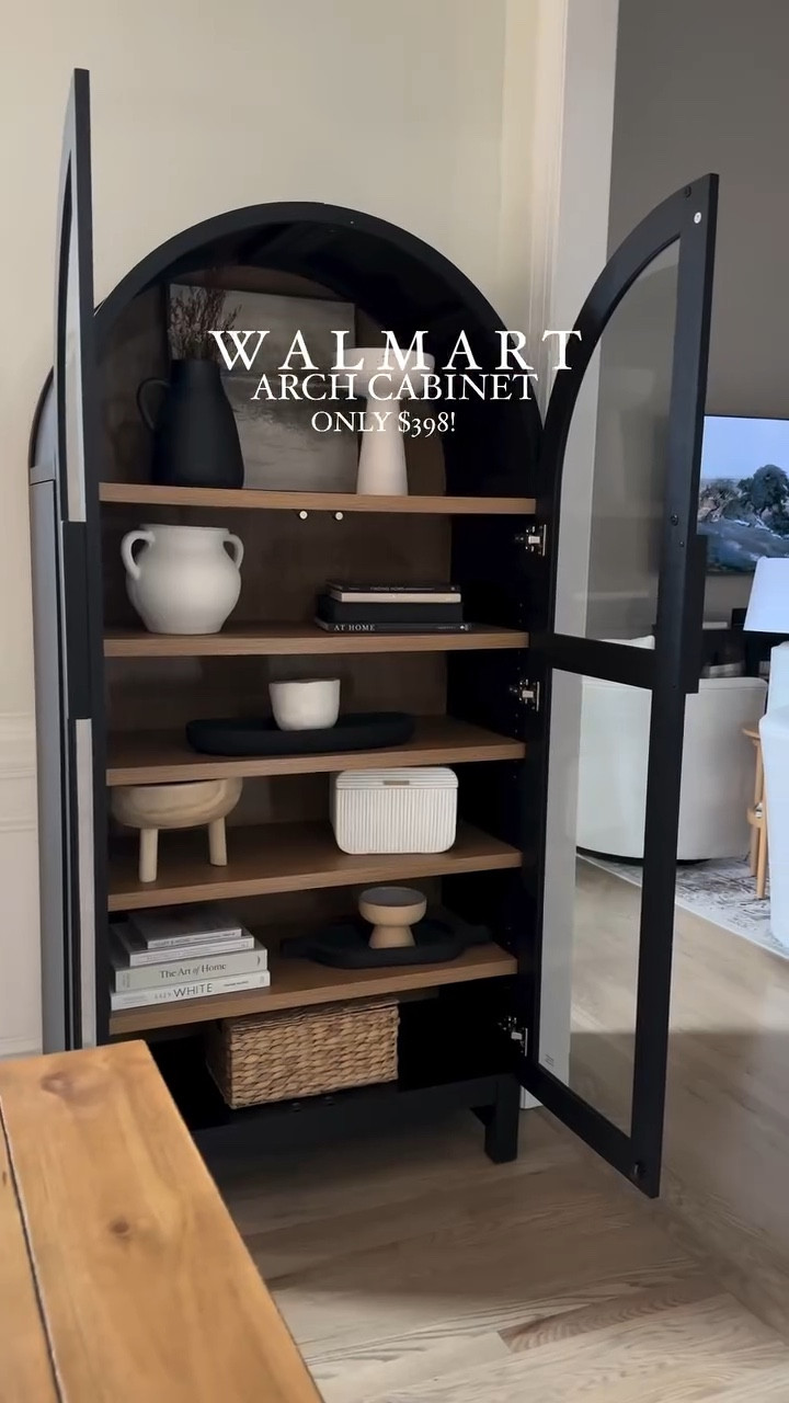 Can you believe this arched cabinet is only $398?! 🤩

It comes in an oak color as well, and the scale is so good! 36 in W x 16.375 in D x 72.25 in H - so very similar to other designer options that are 5-10x this price!

It’s does not come assembled, so prepare to take time to assemble, but it’s so worth it as it’s a nice and sturdy and looks so high end!

This spot in my dining room was the perfect spot for it, and I’m loving how it compliments my other black accents in my space. 

What do you think?


#walmartpartner #homestyle #homestyling #interiordesign #walmarthome #walmartfinds #archedcabinet #cabinet #cabinetstyling #affordablehomedecor #homedecor #homestyling  #neutralhome #myneutralhome #homedecorating #homedecorfinds #livingroomdecor #livingroom #bedroomdecor #diningroomdecor #organicmodern #modernorganic #ltkhome

#LTKHome #LTKSaleAlert #LTKWatchNow