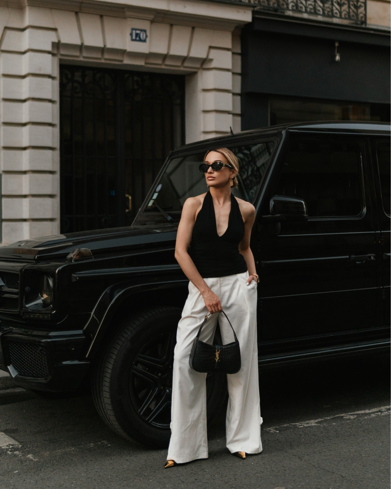 Paris Chic Black & White Outfit | Quiet Luxury Summer Style

Paris-inspired black and white outfit featuring a black halter top, white tailored trousers, black shoulder bag, slingback heels, statement sunglasses and gold jewelry. The perfect quiet luxury look for summer vacations, European city trips, date nights, brunch, elevated everyday style and chic capsule wardrobes.

#LTKgrwm #LTKootd
