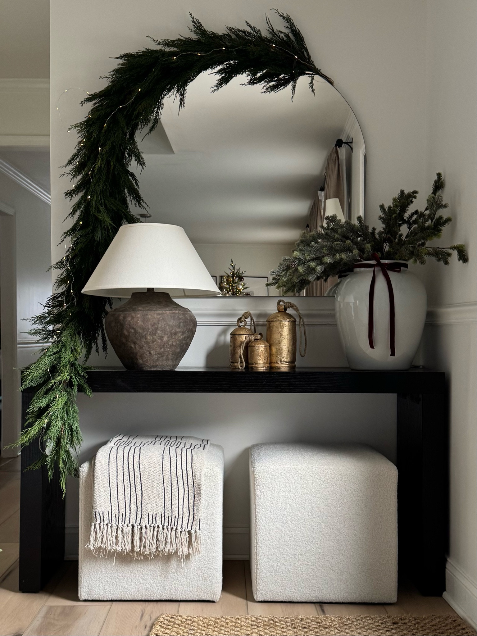 Christmas entryway styling. My favorite garland!!! I used two strands here

#LTKHome #LTKSeasonal #LTKHoliday