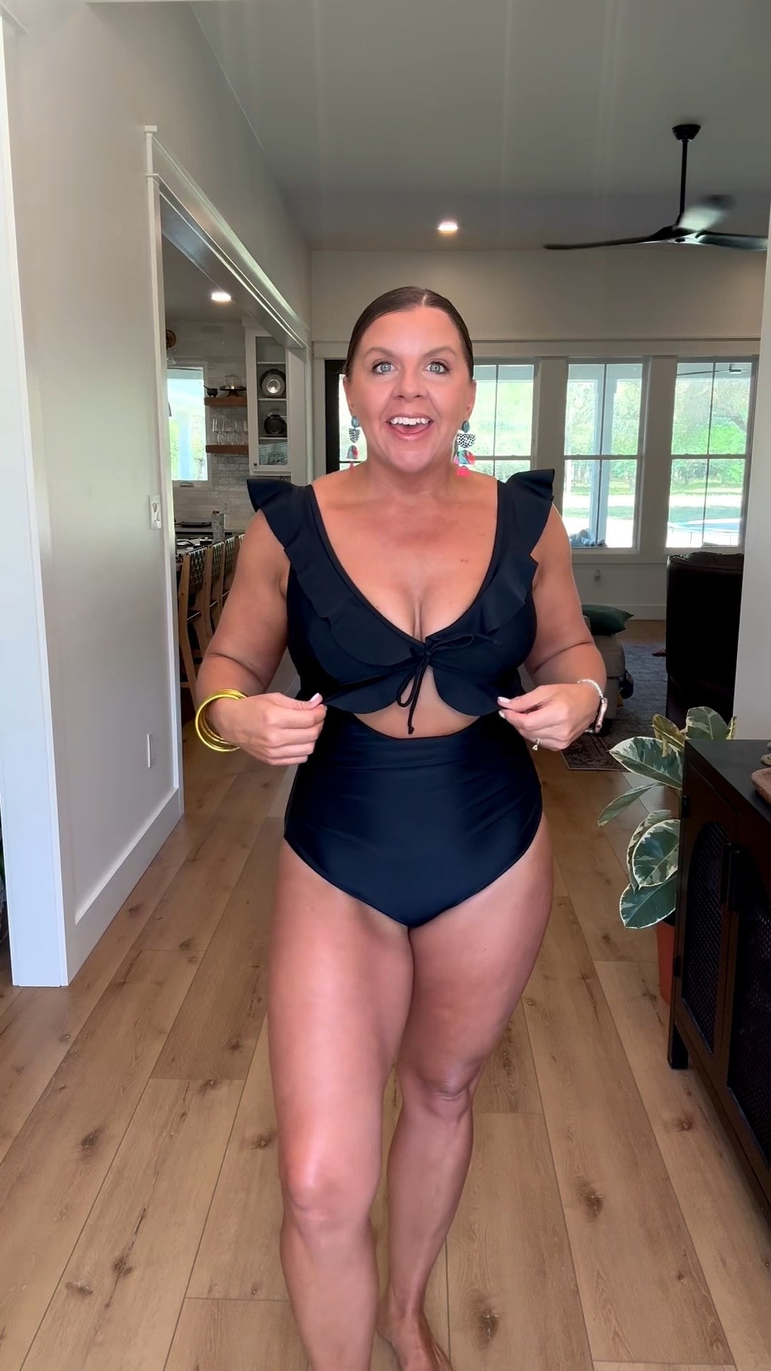 Absolutely loving this ruffle one piece with a little tummy showing. Adjustable straps, full coverage, and the perfect details. 

Mom swimsuit, swimsuit, bathing suit, one piece, black swimsuit, modest coverage, Amazon swim 