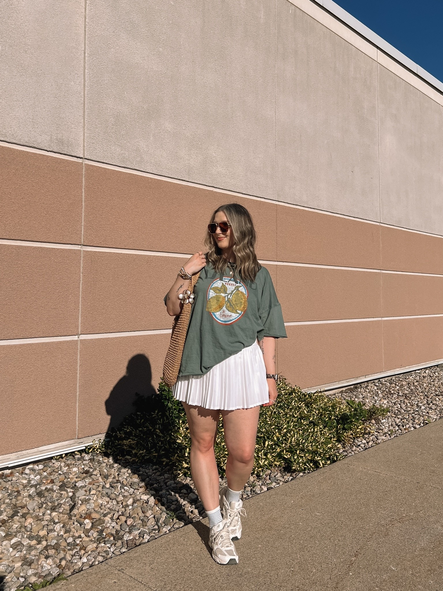 Casual spring to summer outfit! Wearing my usual size L in the graphic tee. Wearing M in the white tennis skirt, I bought it years ago & if I was ordering now I’d get L although M still fits. New Balance sneakers run a little big, I’m a 9.5-10 and wear a 9

#LTKsummer #LTKmidsize #LTKstyletip