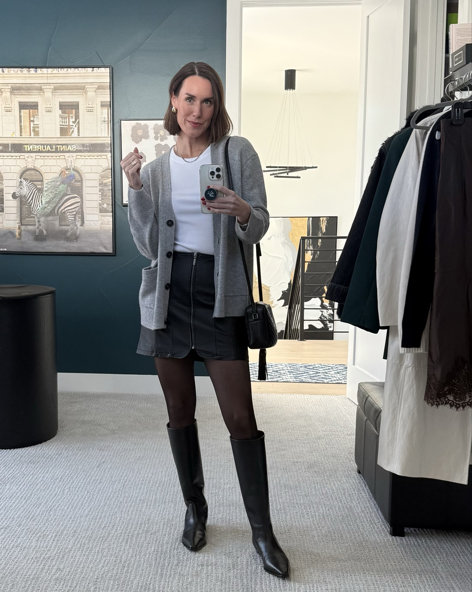 Black, white & gray. Simple, sleek, neutral forward  look. Mixing the leather and cashmere textures, balancing gf out with the tights and pinpointed in the lips. Perfect comfy, casual chic, workday outfit! 🤍🩶🖤
Leather skirt. Cashmere sweater. Sheer tights. Winter style. Work outfit. Comfy, cozy, chic. 