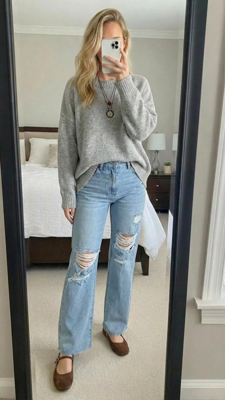 This is one of those **effortless, everyday outfits** that you end up reaching for on repeat 🤍

A soft, slouchy gray sweater paired with light-wash distressed denim is such a timeless combo, but it’s the relaxed fit and cozy textures that really make this look work. The sweater drapes just right — not too oversized, not too fitted — giving that lived-in, comfy feel while still looking intentional and put together. It’s the kind of knit you can half-tuck, front-tuck, or let hang loose and it always looks good.

The light-wash jeans add a casual, laid-back vibe, and the subtle distressing keeps the outfit from feeling too polished or stiff. This is an easy “throw on and go” look that still feels styled, especially with the warm brown Mary Jane flats. That pop of brown grounds the outfit and adds a cozy, transitional touch that works perfectly for everyday life — errands, coffee runs, casual lunches, school drop-off, or working from home and heading out later.

This is the definition of **comfortable but cute** — the kind of outfit that feels effortless, wearable, and confidence-boosting without trying too hard. If you love neutral outfits that mix cozy textures with classic denim, this one is absolutely worth saving.

**Keywords:** casual winter outfit, gray sweater outfit, everyday jeans outfit, comfy casual style, neutral outfit ideas, effortless outfit, cozy chic look, mom style, capsule wardrobe, casual fashion, laid-back outfit, timeless basics


#LTKdayinmylife #LTKgrwm #LTKfitnessgoals