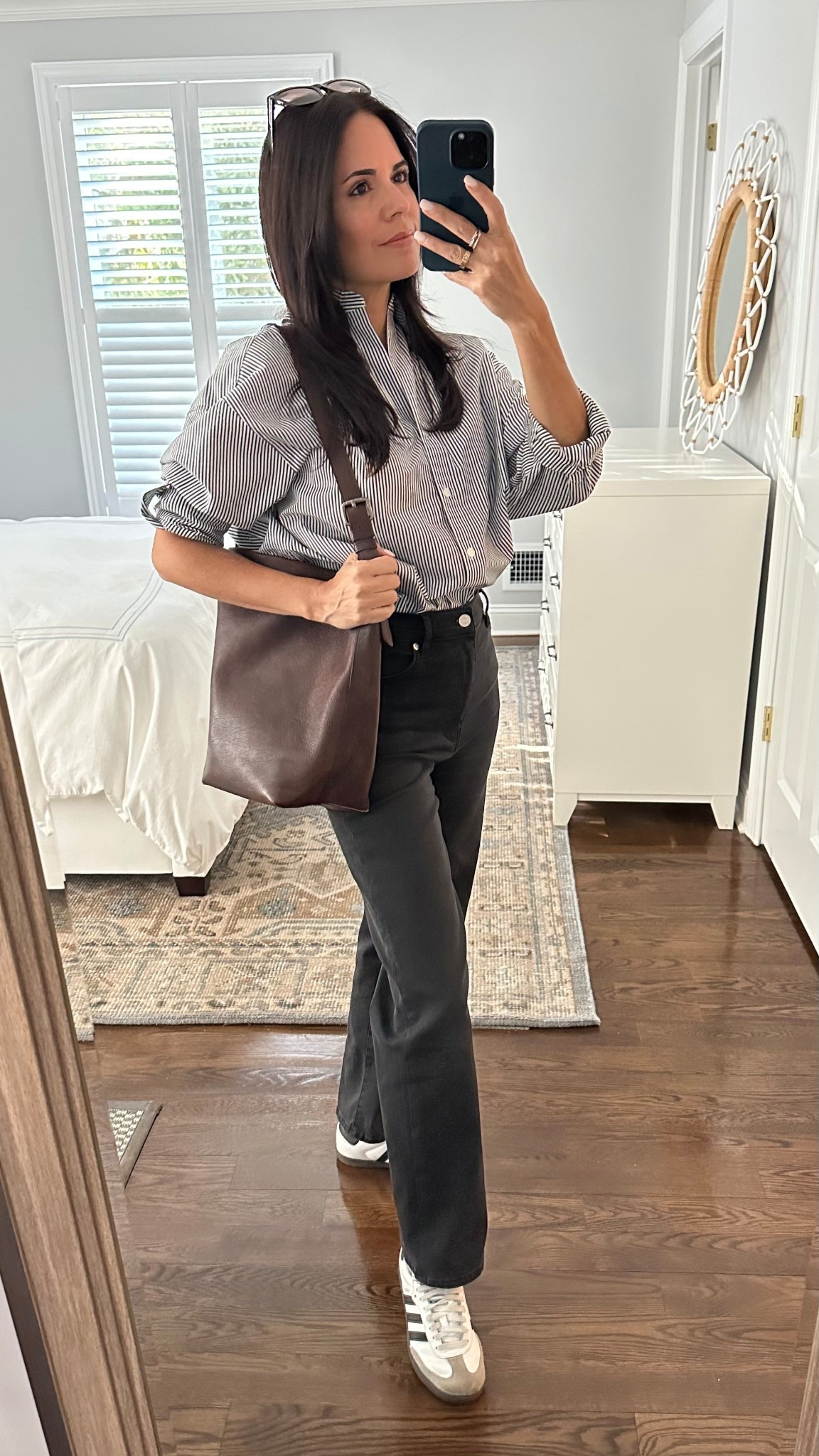 Spring look. Striped shirt, straight leg jeans by Frame, Adidas sneakers, Chocolate brown leather bucket bag

#LTKSeasonal #LTKStyleTip #LTKShoeCrush
