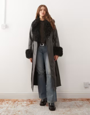 Reclaimed Vintage longline leather look trench coat with faux fur collar and cuffs in black | ASOS (Global)